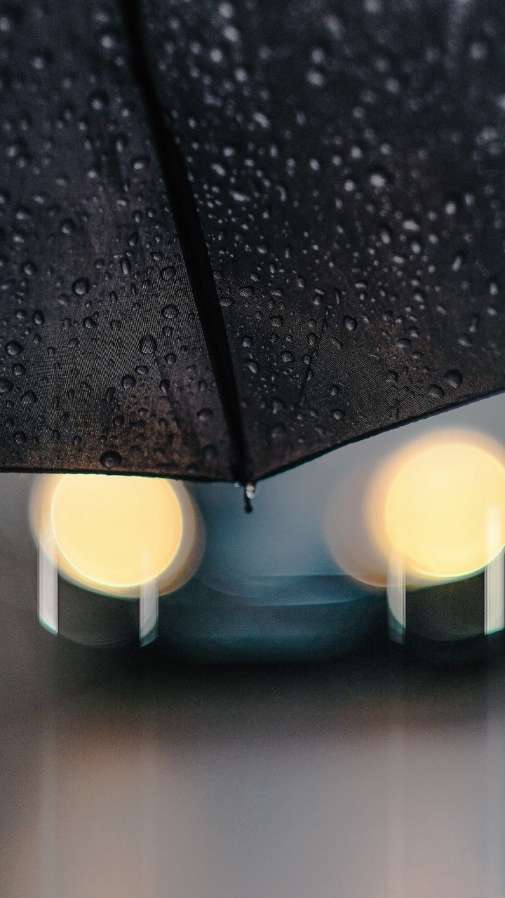 Black Umbrella on White Plastic Bucket. Wallpaper in 720x1280 Resolution