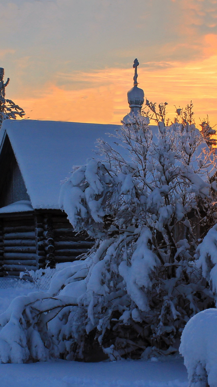 Brown Wooden House Covered With Snow During Sunset. Wallpaper in 750x1334 Resolution