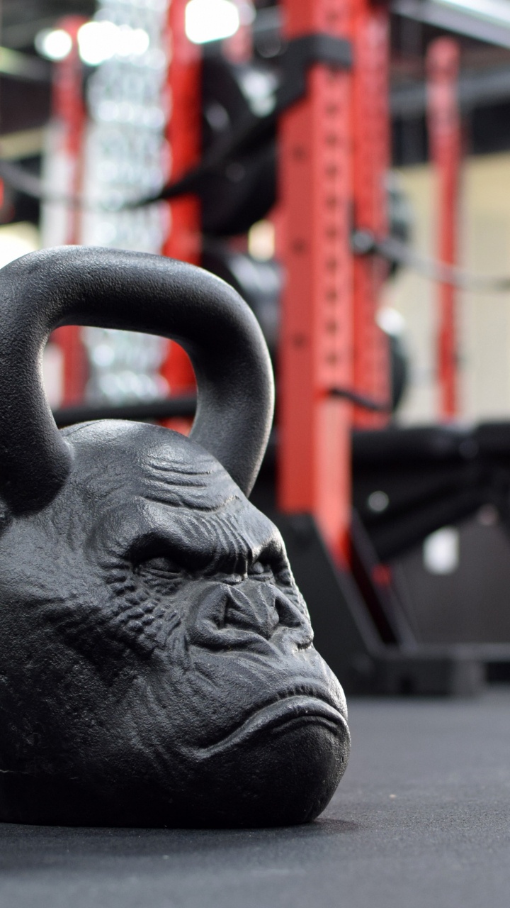 Black Ceramic Head Bust on Black Surface. Wallpaper in 720x1280 Resolution