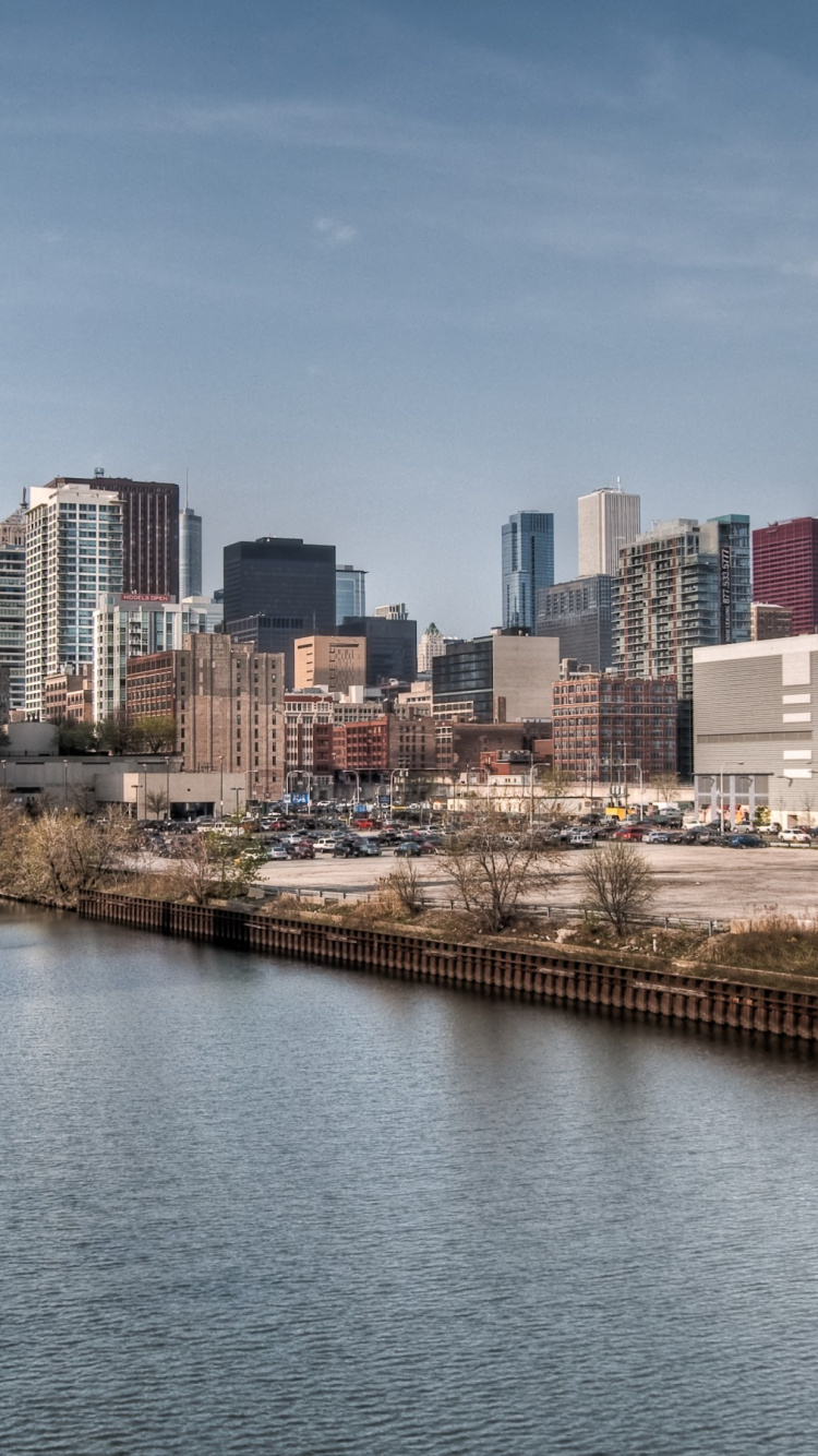 City Buildings Near Body of Water During Daytime. Wallpaper in 750x1334 Resolution