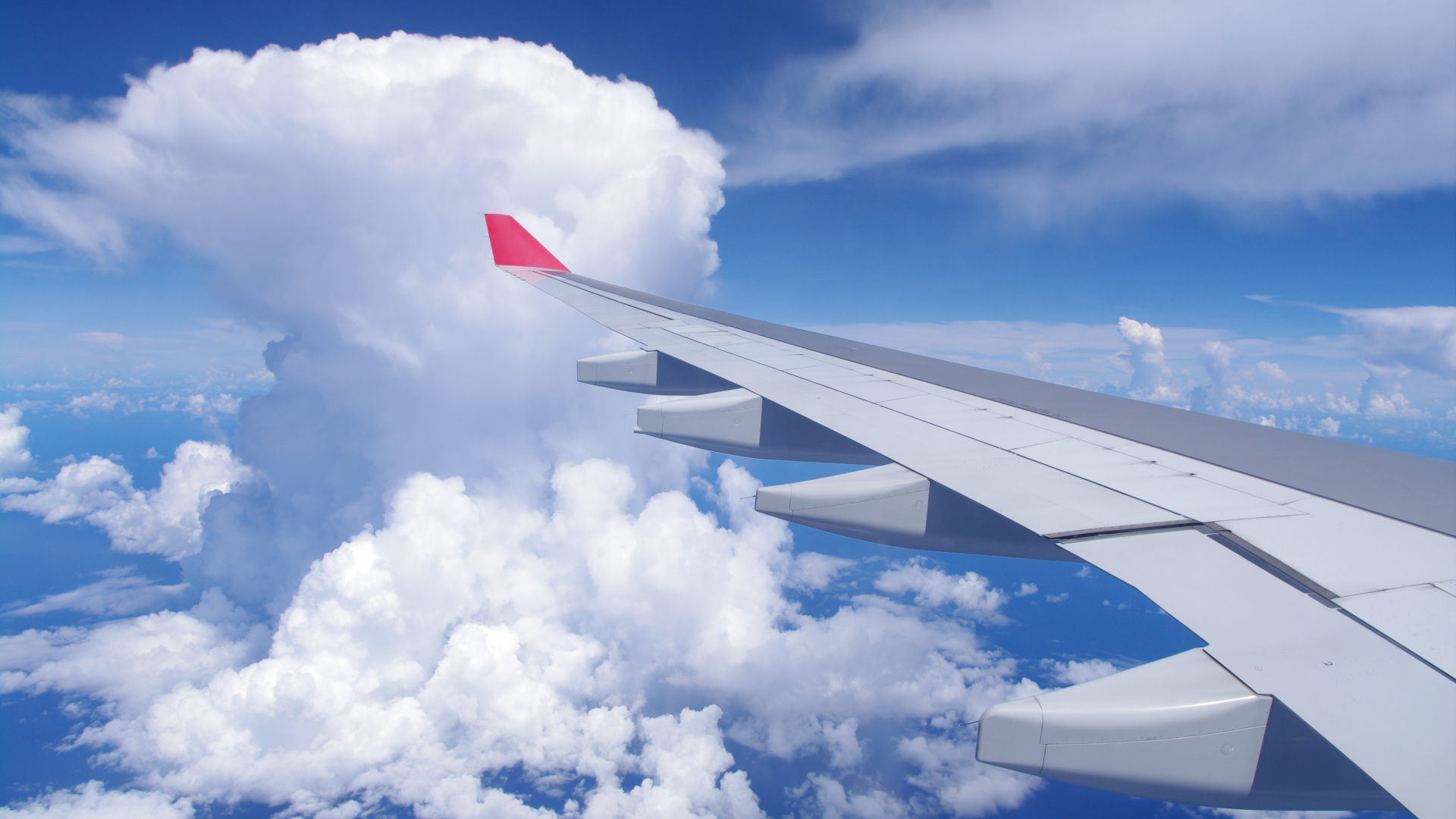 White and Red Airplane Wing Under Blue Sky and White Clouds During Daytime. Wallpaper in 1920x1080 Resolution
