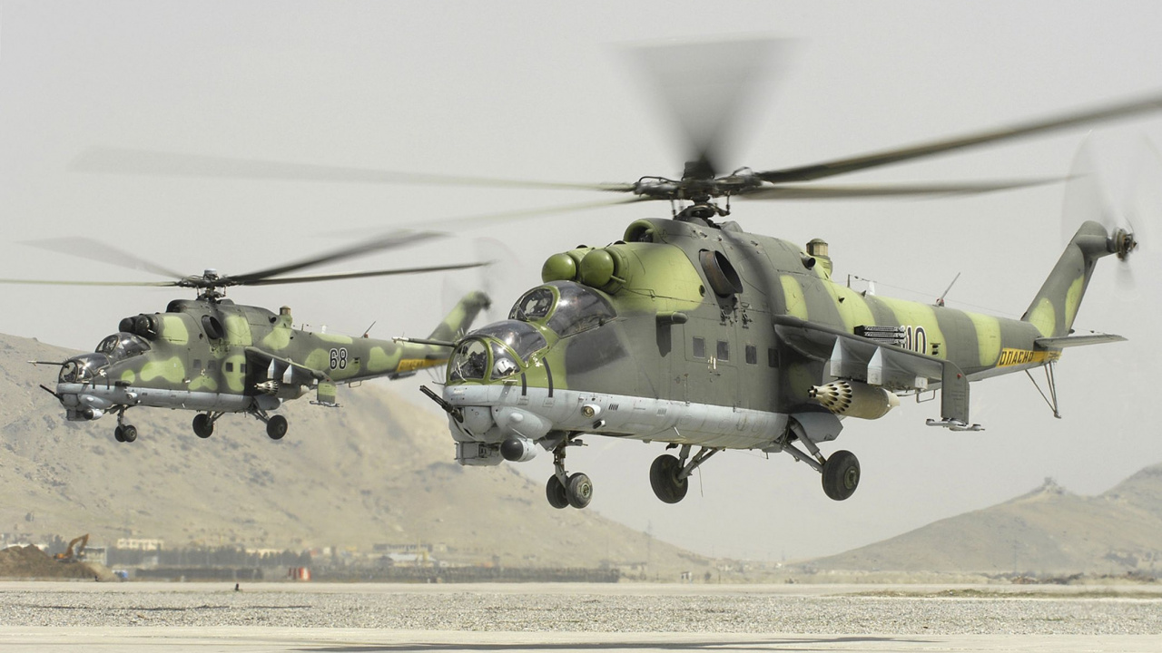 Green and Black Helicopter on Gray Concrete Ground During Daytime. Wallpaper in 1280x720 Resolution