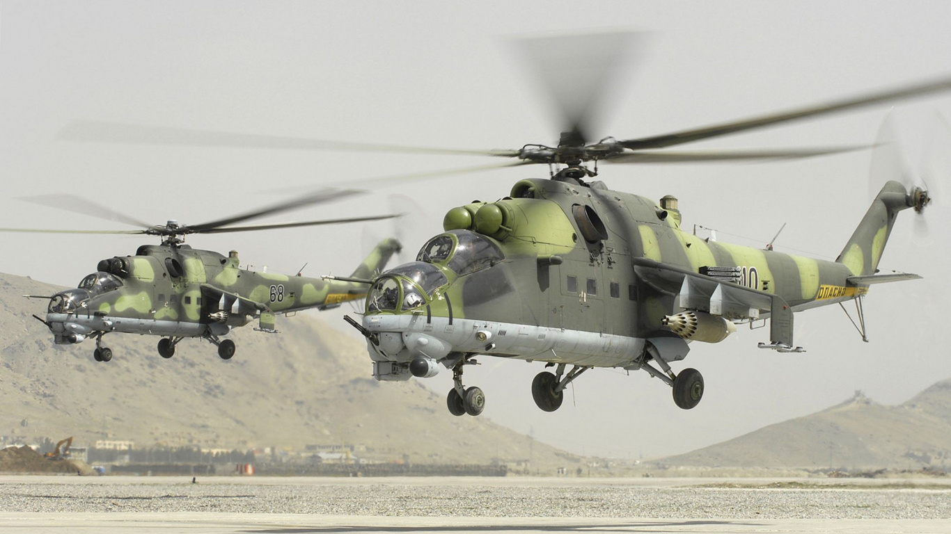 Green and Black Helicopter on Gray Concrete Ground During Daytime. Wallpaper in 1366x768 Resolution