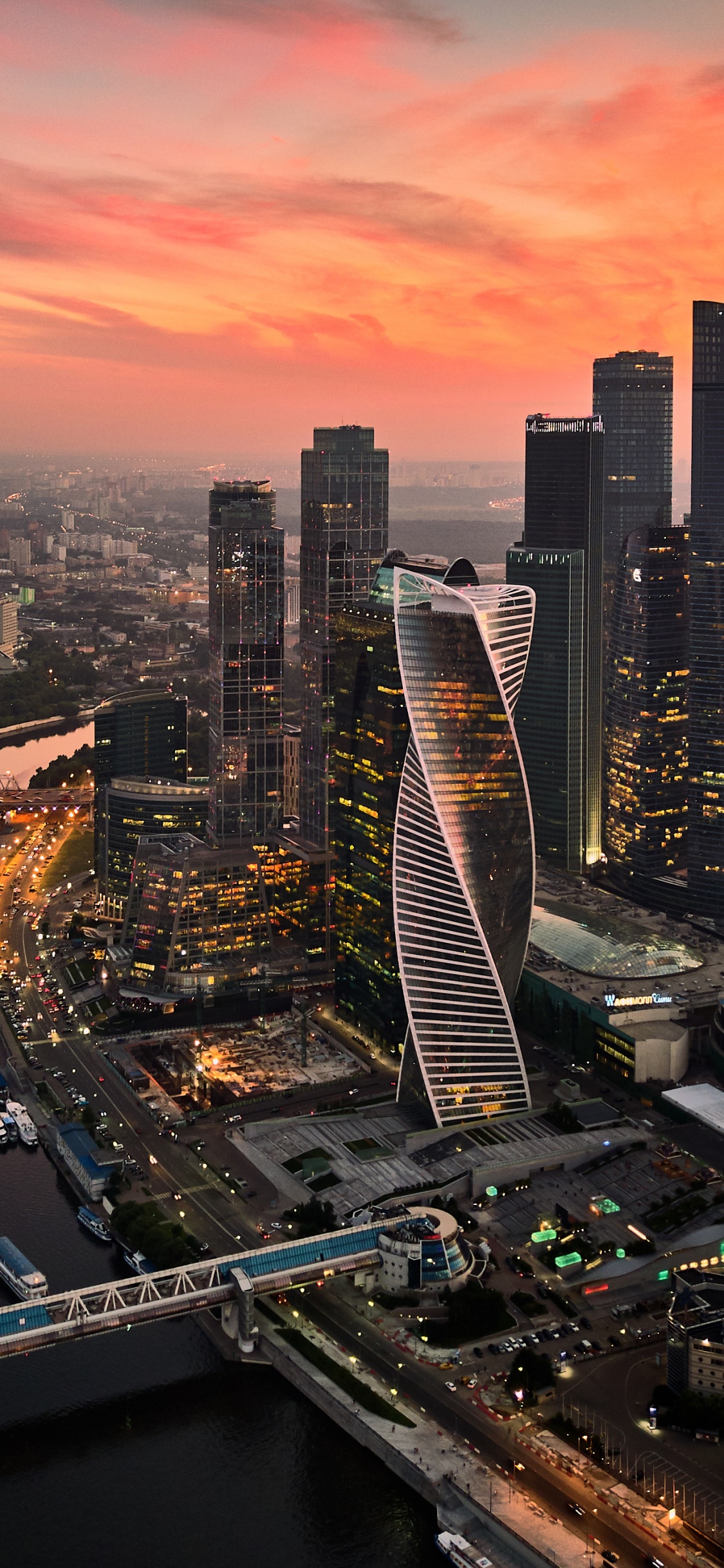 Aerial View of City Buildings During Night Time. Wallpaper in 1125x2436 Resolution