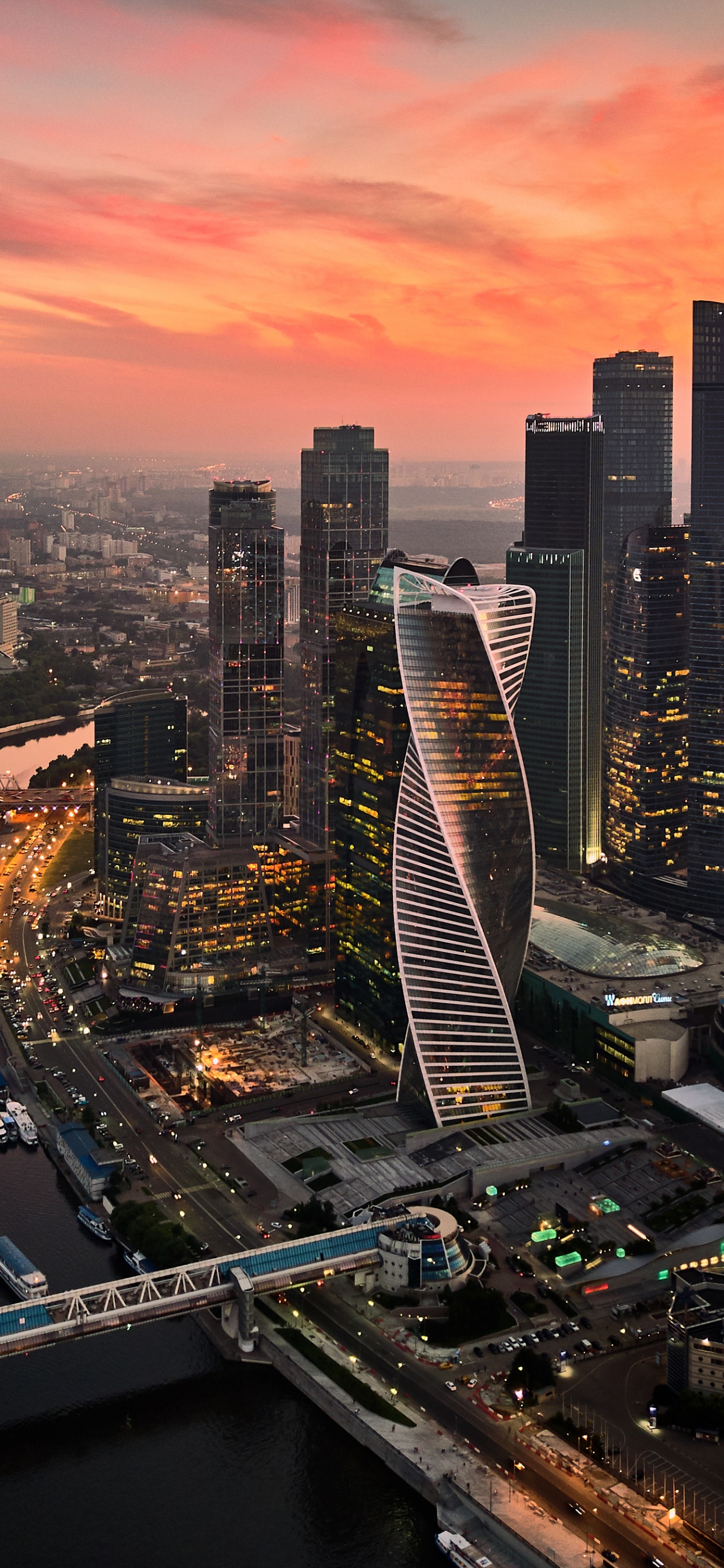 Aerial View of City Buildings During Night Time. Wallpaper in 1242x2688 Resolution