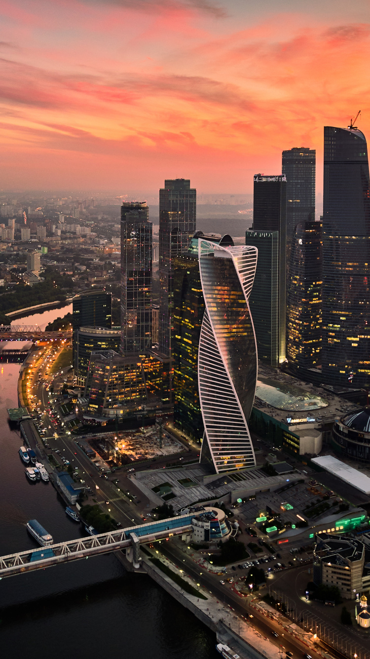 Aerial View of City Buildings During Night Time. Wallpaper in 750x1334 Resolution