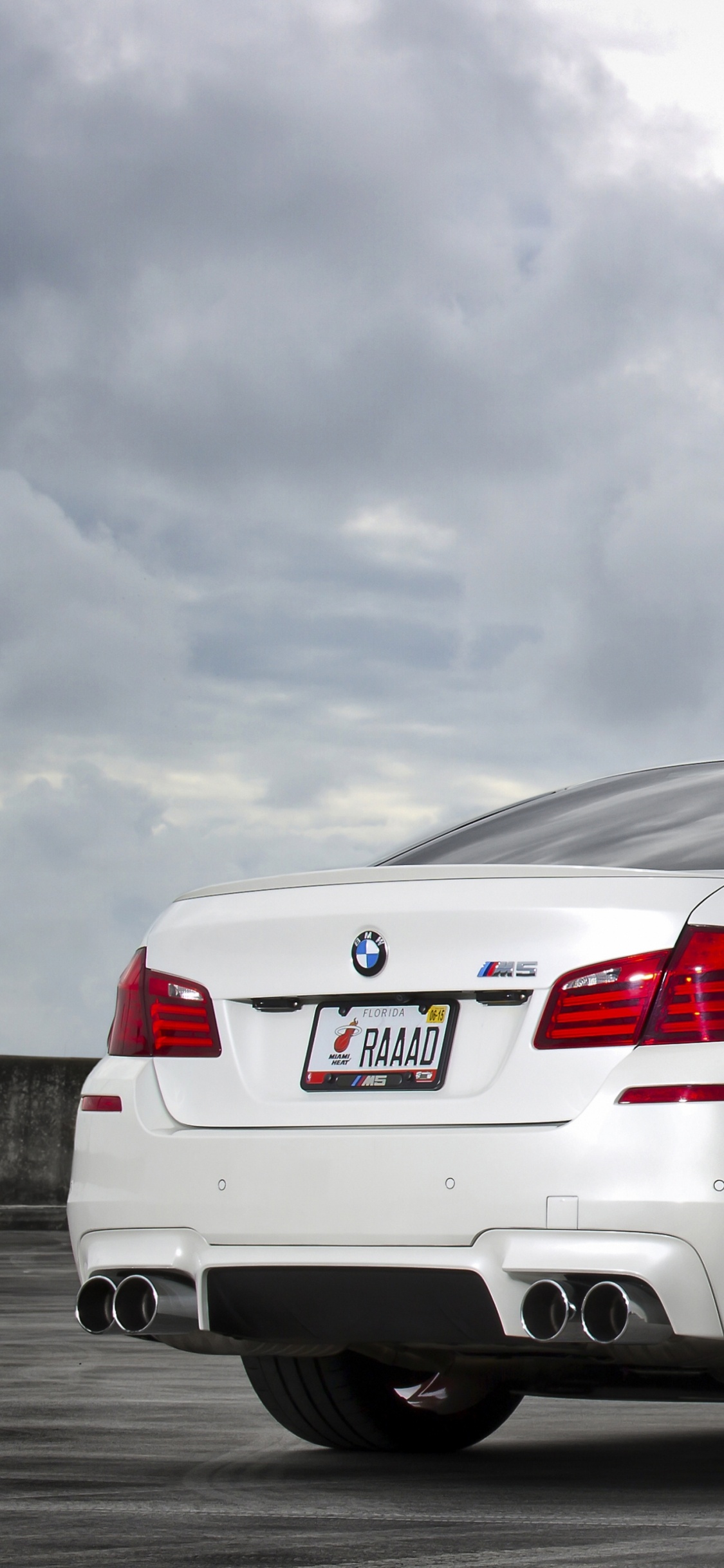 White Bmw m 3 Coupe on Gray Asphalt Road. Wallpaper in 1125x2436 Resolution