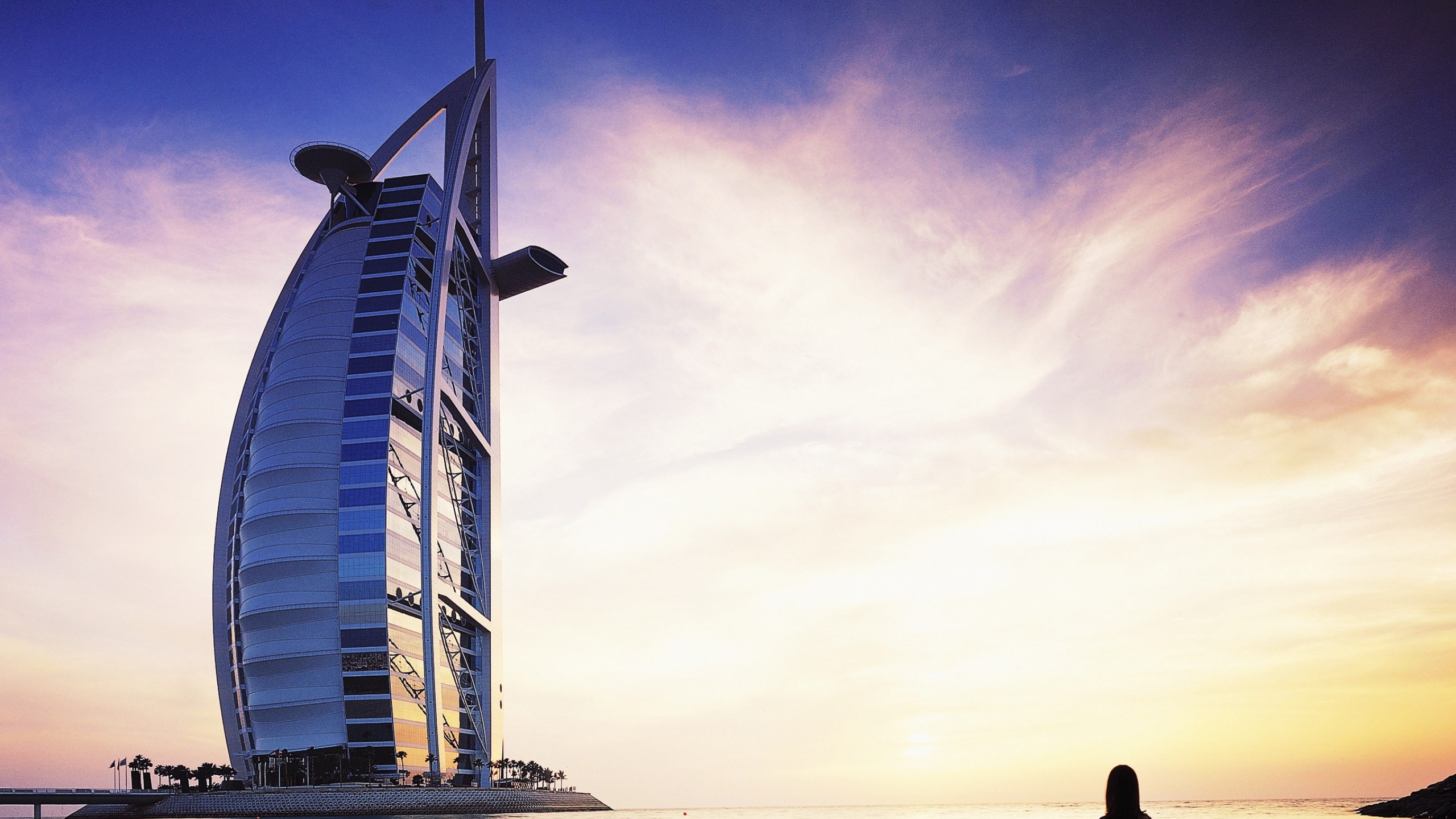 Man and Woman Standing on Beach During Daytime. Wallpaper in 2560x1440 Resolution