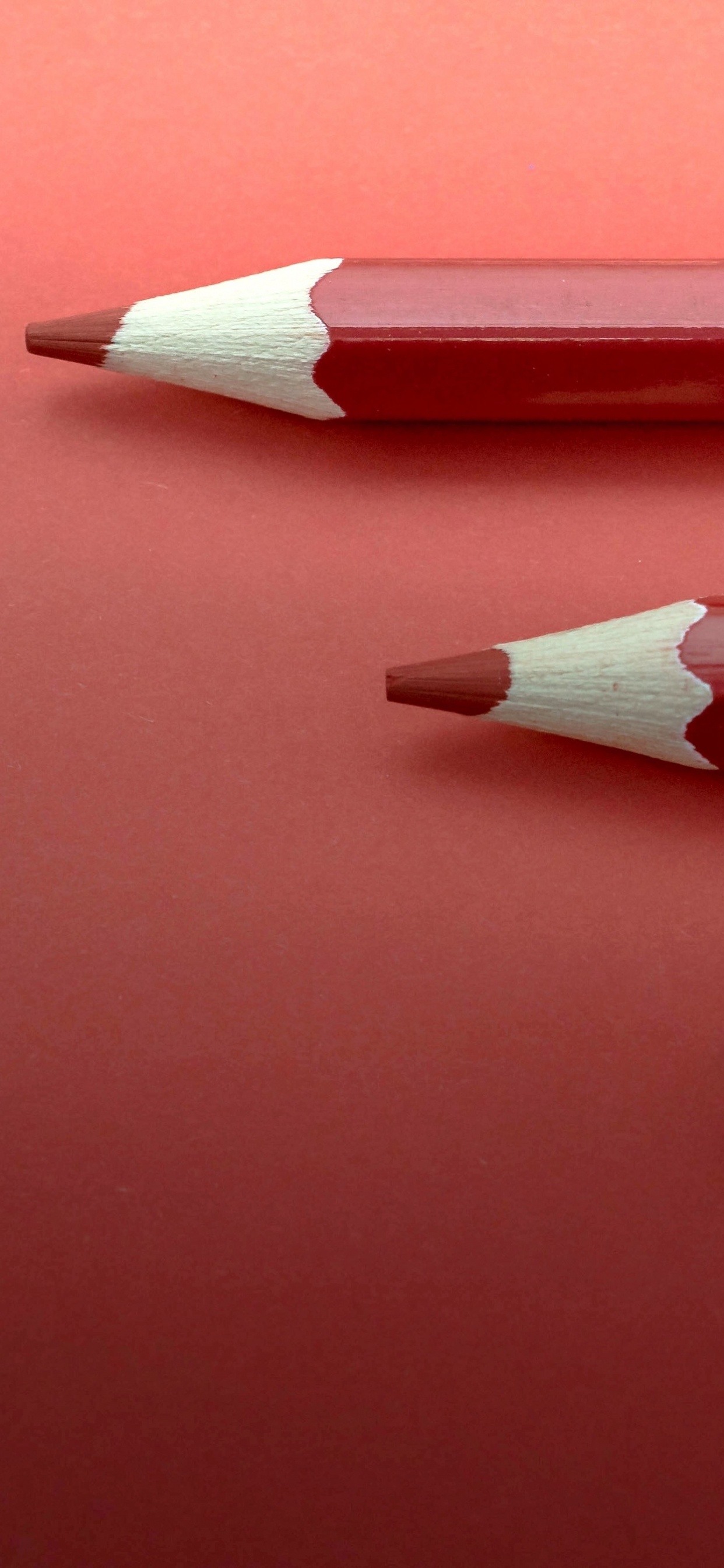 Red Color Pencil on Red Surface. Wallpaper in 1242x2688 Resolution