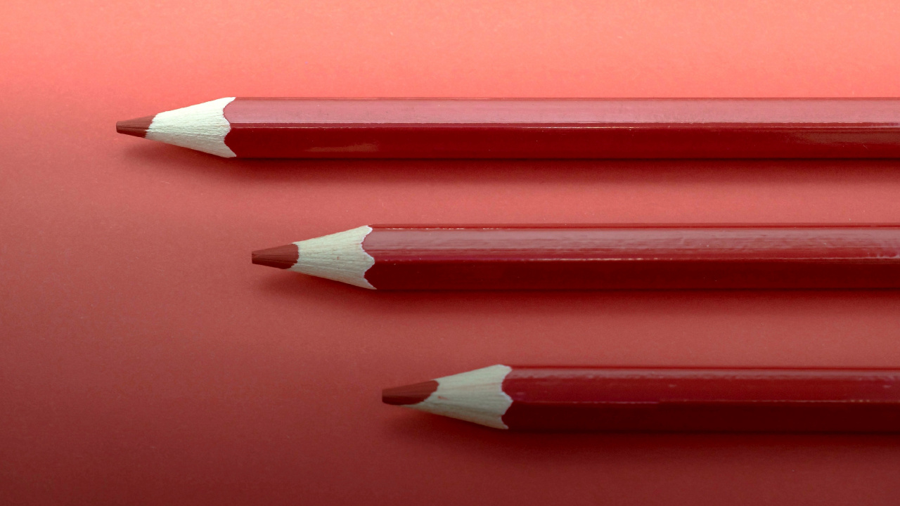 Red Color Pencil on Red Surface. Wallpaper in 1280x720 Resolution