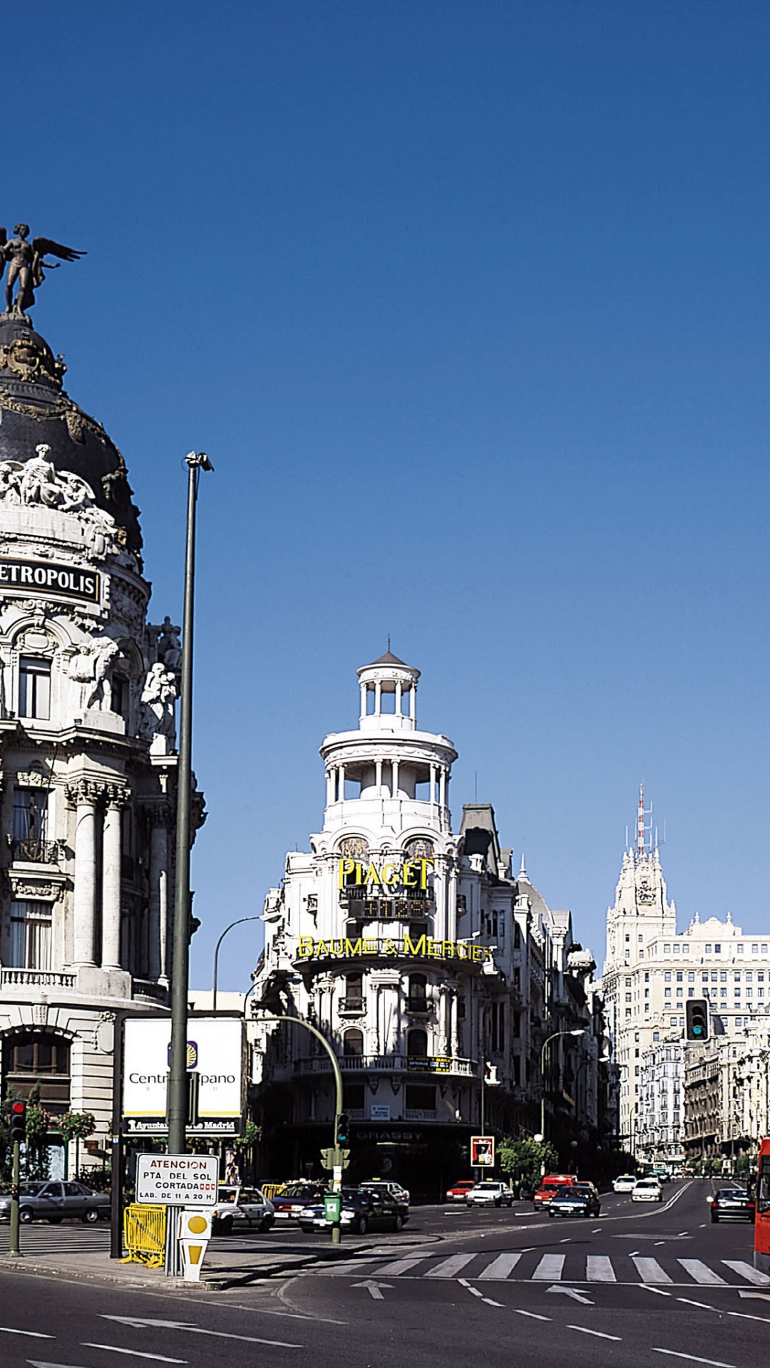 Cars on Road Near White Concrete Building During Daytime. Wallpaper in 1080x1920 Resolution