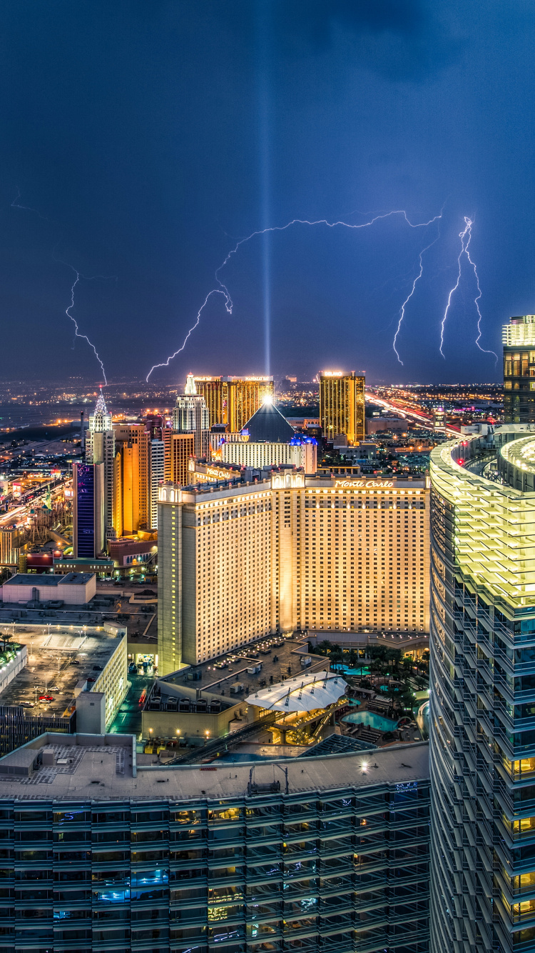 City With High Rise Buildings During Night Time. Wallpaper in 750x1334 Resolution