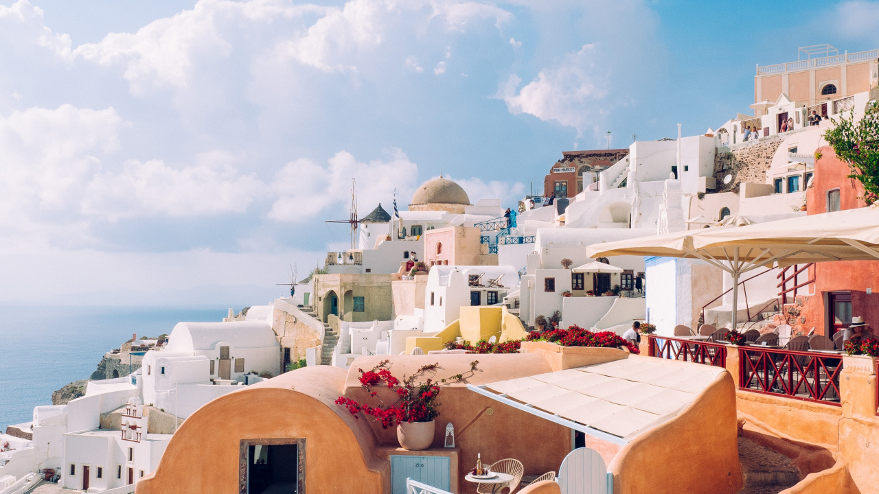 Brown and White Concrete Buildings Under Blue Sky During Daytime. Wallpaper in 1280x720 Resolution
