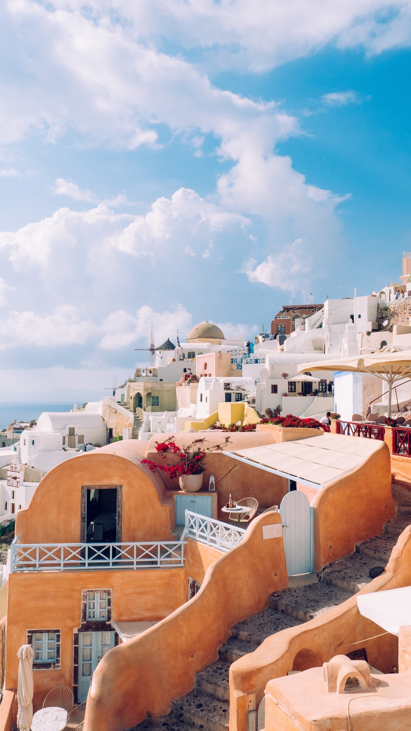 Brown and White Concrete Buildings Under Blue Sky During Daytime. Wallpaper in 1440x2560 Resolution