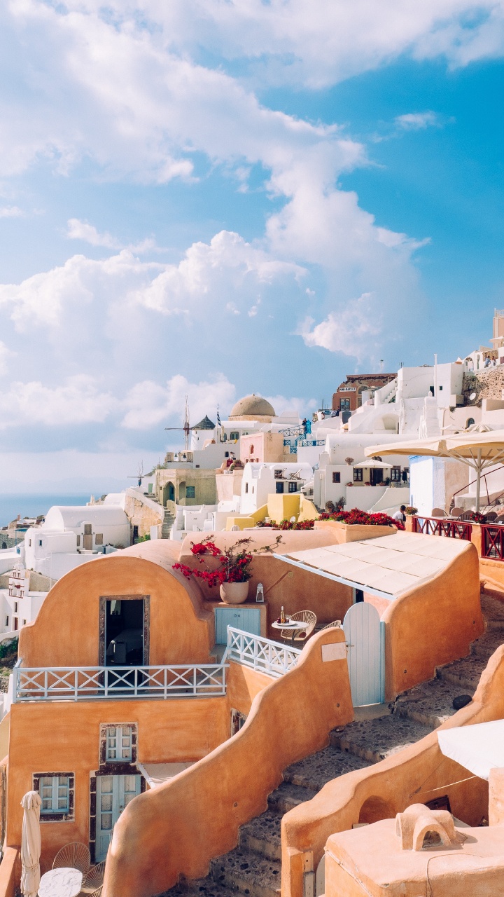 Brown and White Concrete Buildings Under Blue Sky During Daytime. Wallpaper in 720x1280 Resolution