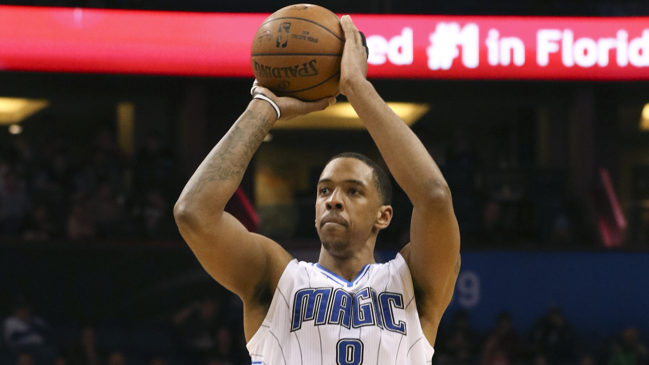 Man in Blue and White Jersey Shirt Holding Basketball. Wallpaper in 1280x720 Resolution