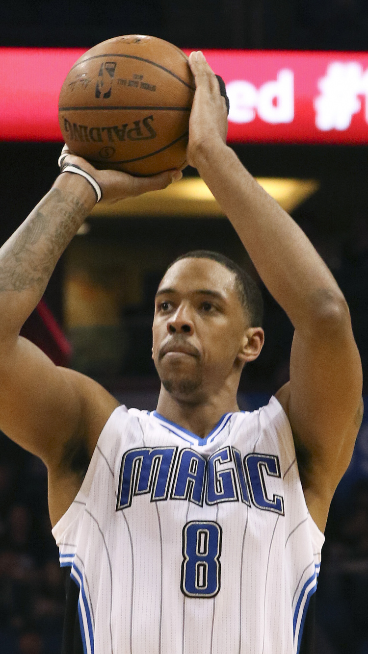 Man in Blue and White Jersey Shirt Holding Basketball. Wallpaper in 750x1334 Resolution