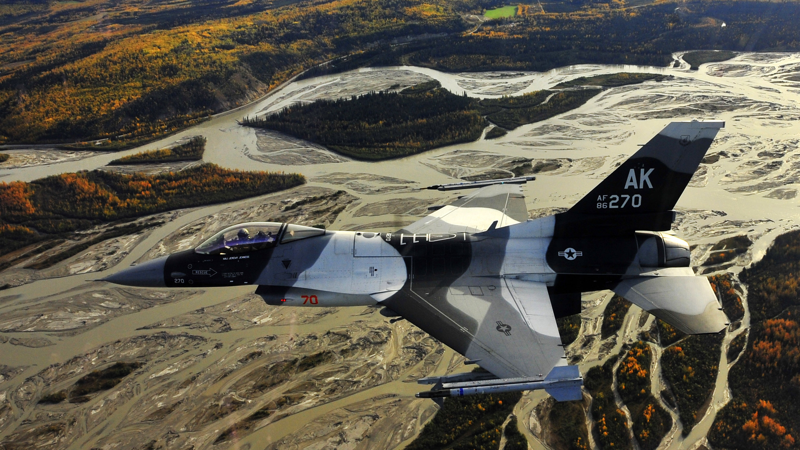 Gray Fighter Plane Flying Over The Mountains During Daytime. Wallpaper in 2560x1440 Resolution
