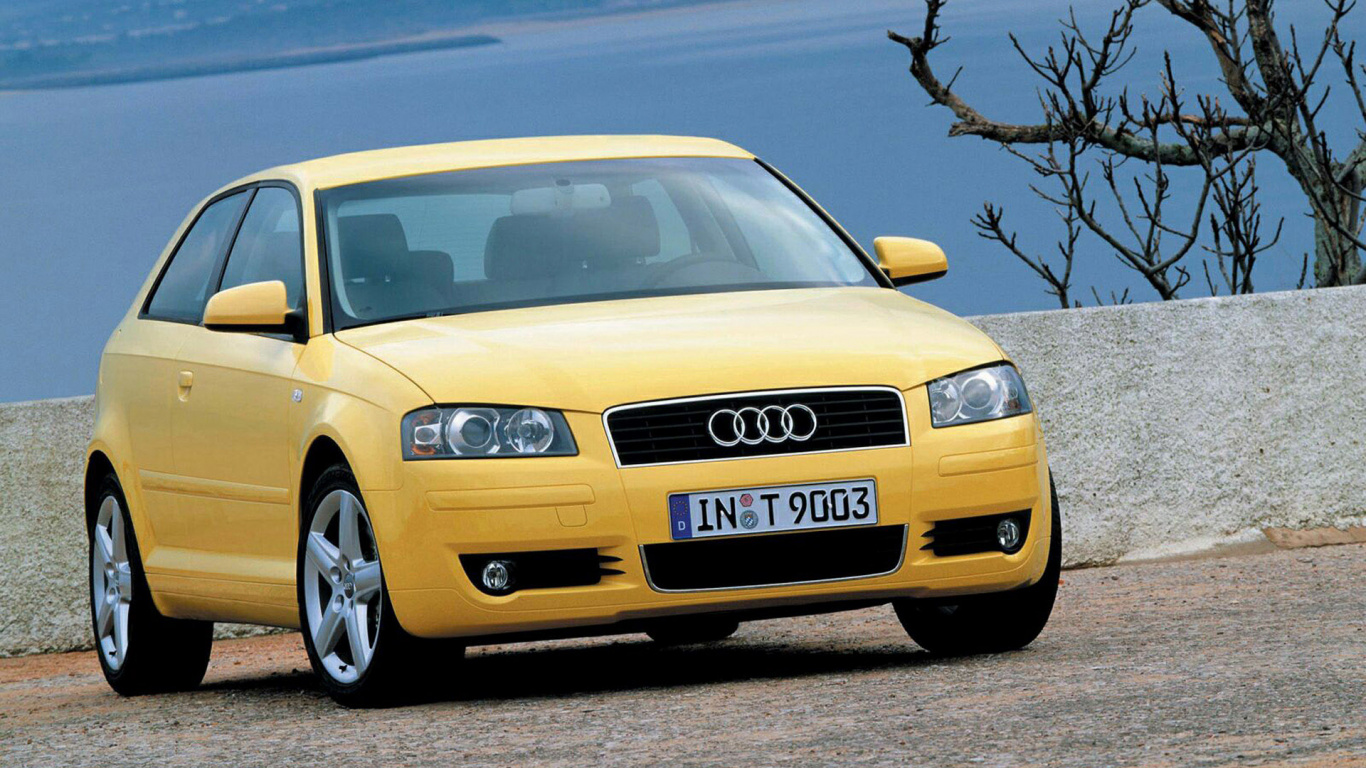 Yellow Porsche 911 on Snow Covered Ground During Daytime. Wallpaper in 1366x768 Resolution