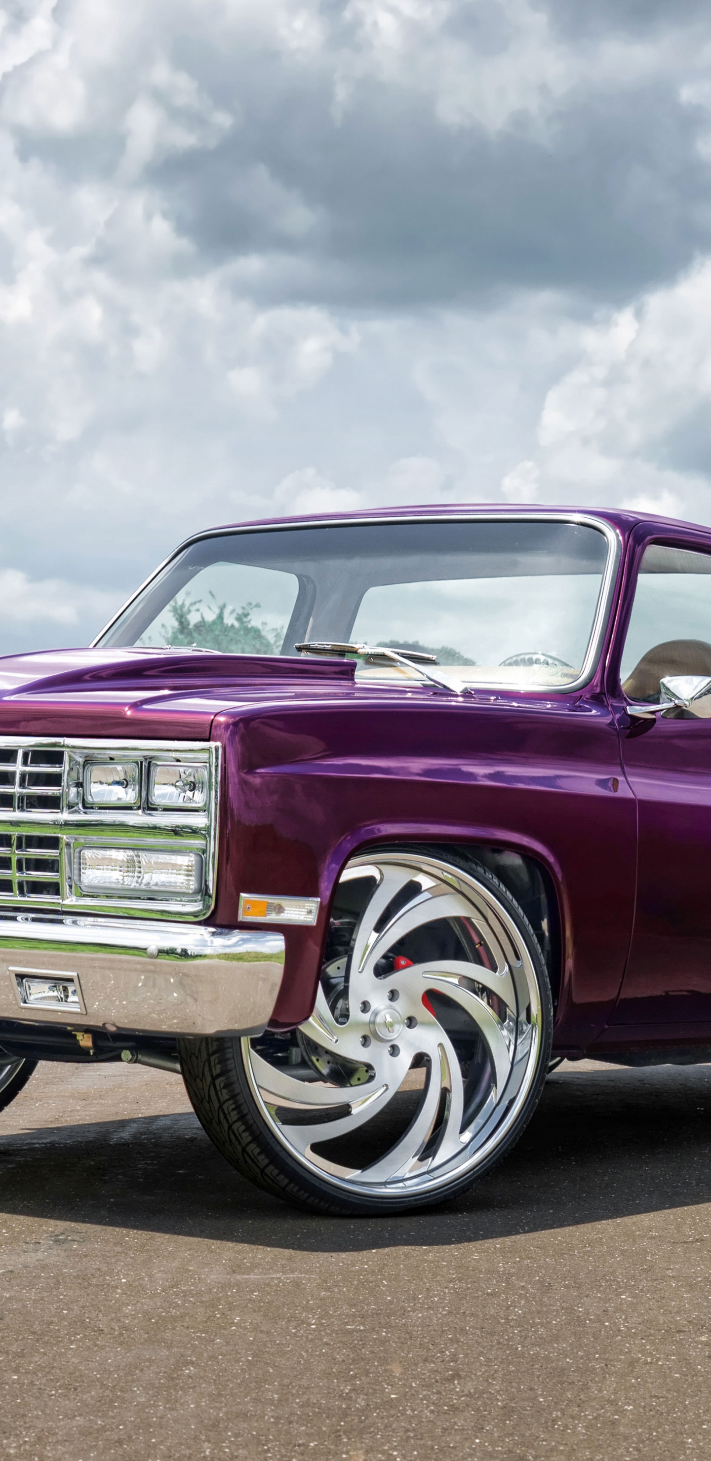 Red Chevrolet Single Cab Pickup Truck on Gray Asphalt Road Under White Clouds and Blue Sky. Wallpaper in 1440x2960 Resolution