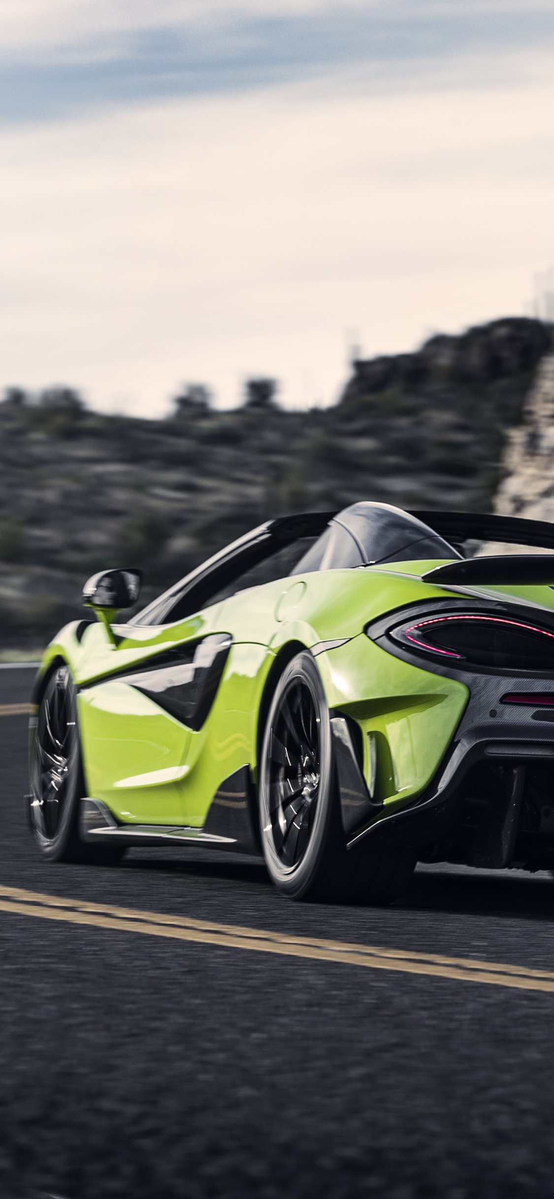 Green and Black Porsche 911 on Road During Daytime. Wallpaper in 1125x2436 Resolution