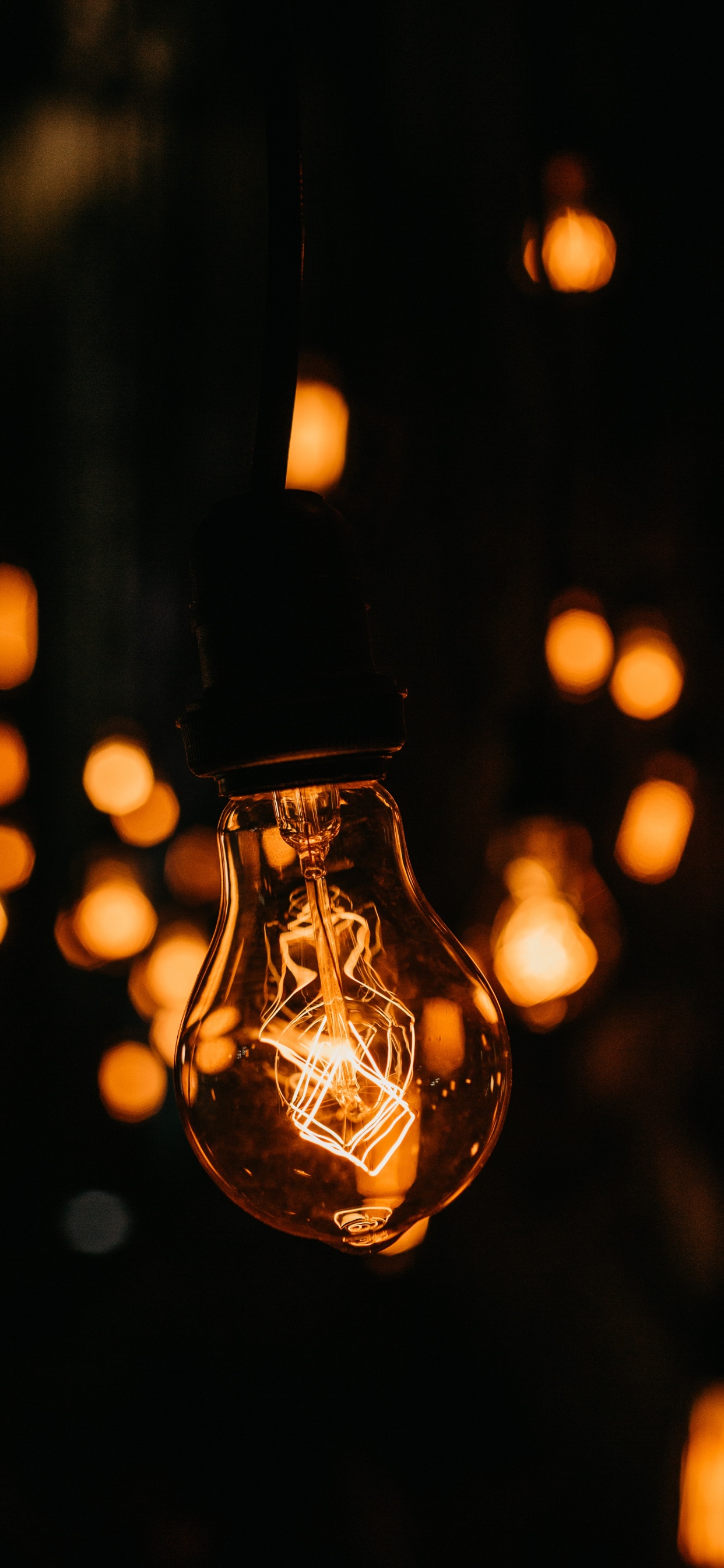 Selective Focus Photography of Light Bulb. Wallpaper in 1242x2688 Resolution