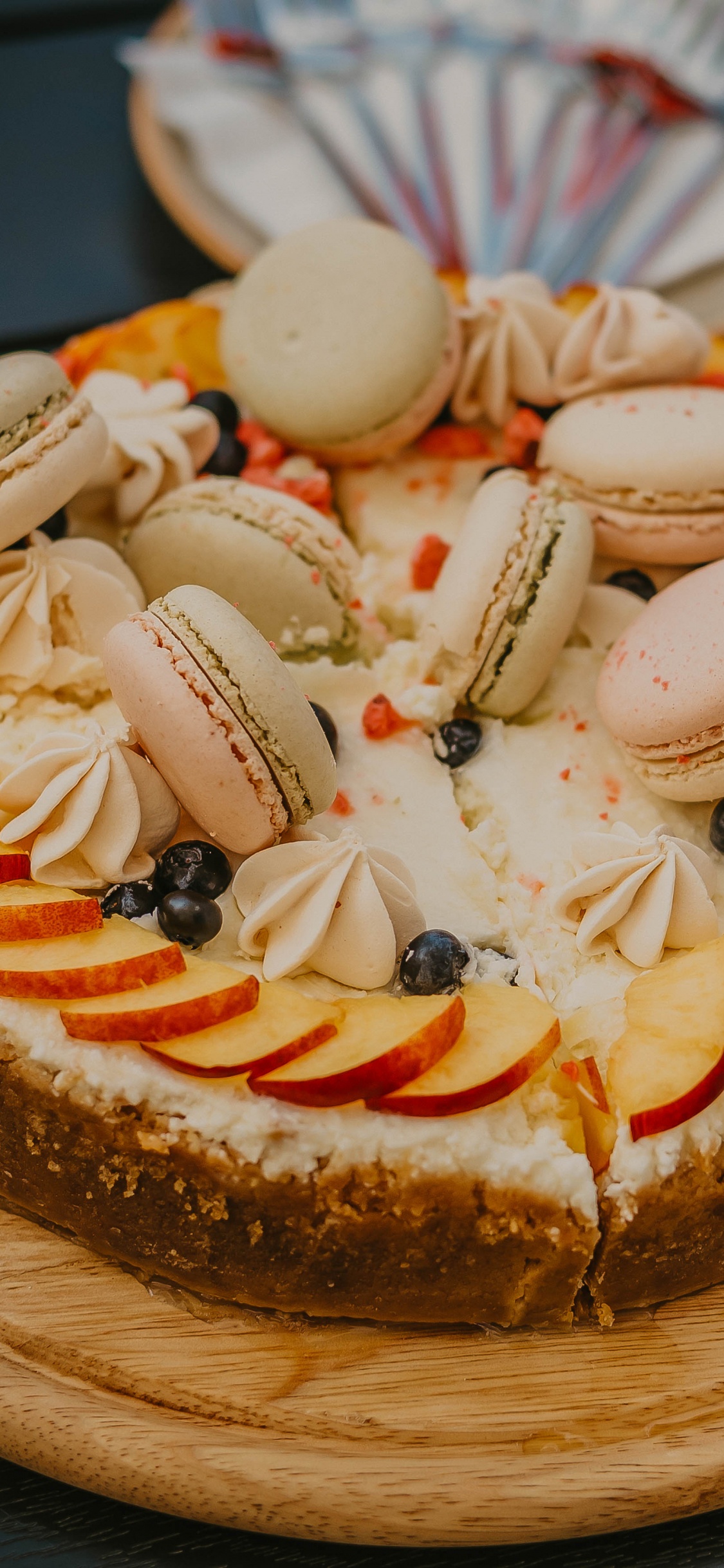 Brown and White Cake With White Icing on Top. Wallpaper in 1125x2436 Resolution