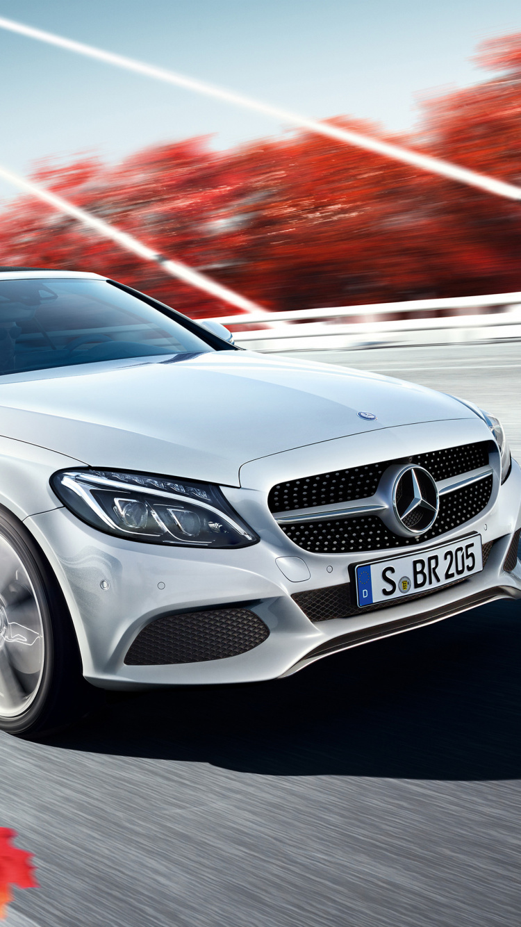 Silver Mercedes Benz Coupe on Road. Wallpaper in 750x1334 Resolution
