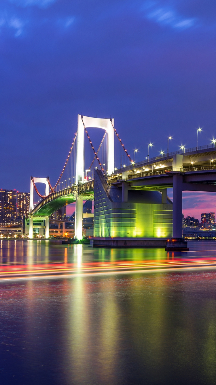 White Bridge Over Water During Night Time. Wallpaper in 750x1334 Resolution