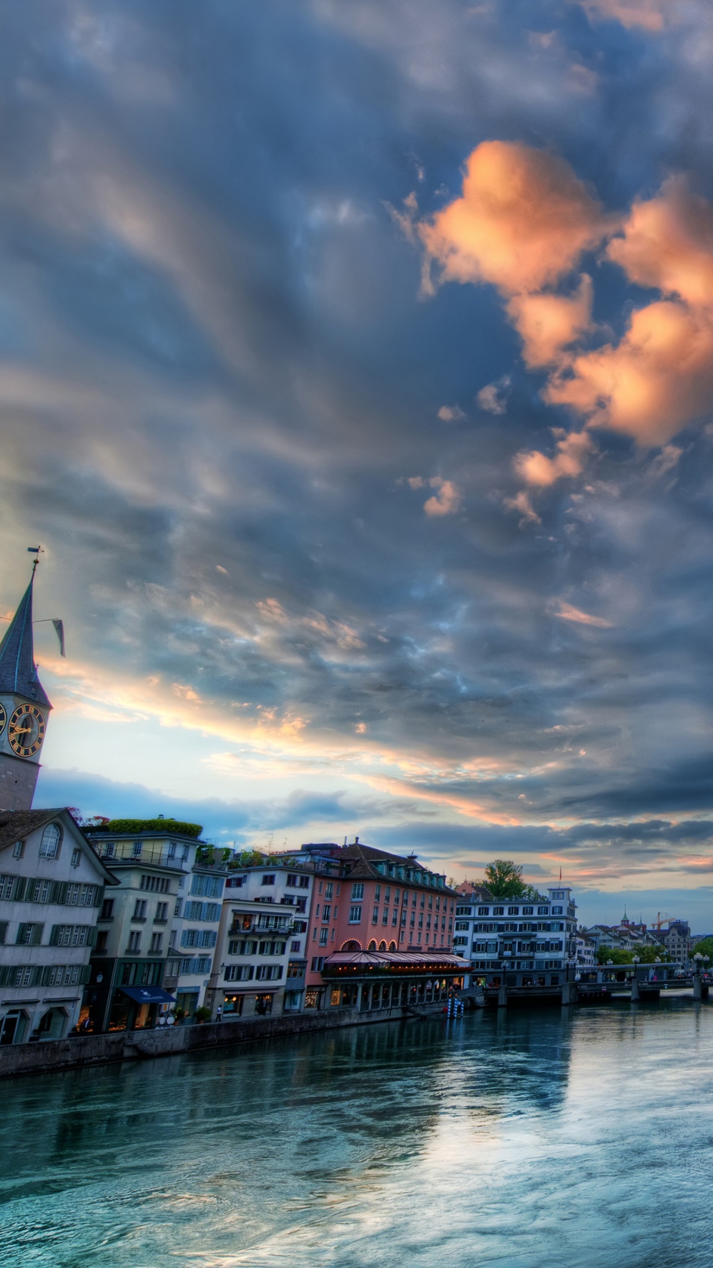 Body of Water Between Buildings Under Cloudy Sky During Daytime. Wallpaper in 1440x2560 Resolution