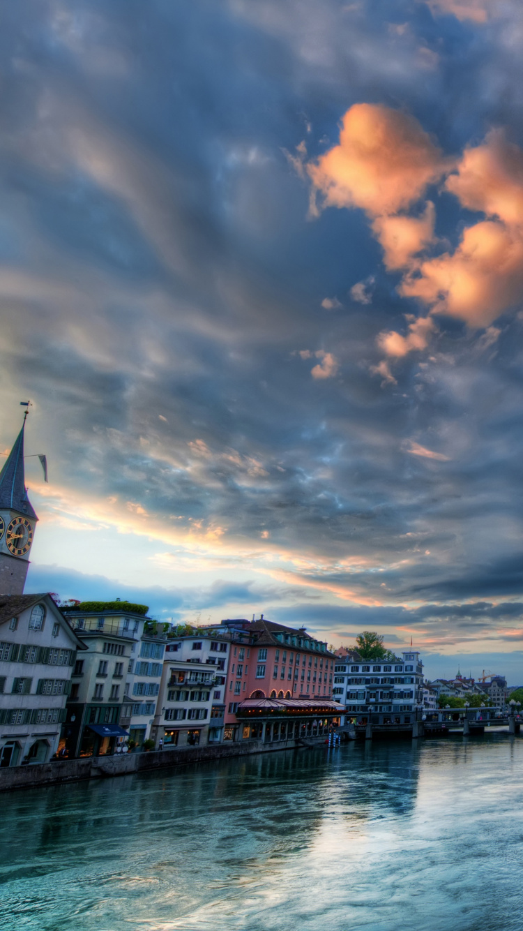Body of Water Between Buildings Under Cloudy Sky During Daytime. Wallpaper in 750x1334 Resolution