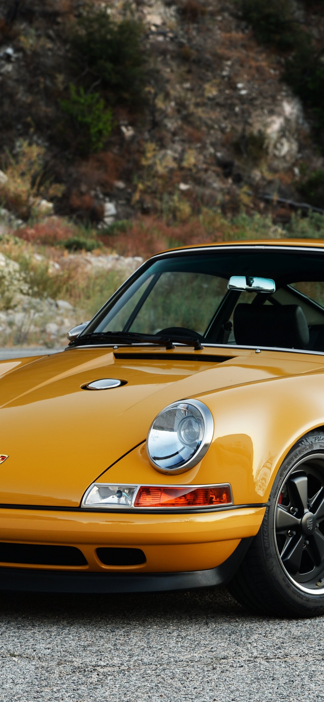Yellow Porsche 911 on Road During Daytime. Wallpaper in 1125x2436 Resolution