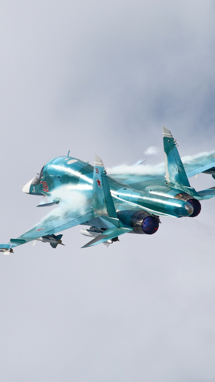 Green and White Fighter Plane Flying in The Sky. Wallpaper in 750x1334 Resolution