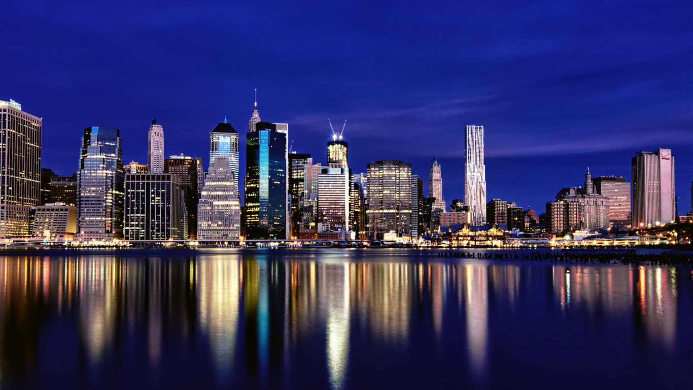 City Skyline Across Body of Water During Night Time. Wallpaper in 1366x768 Resolution