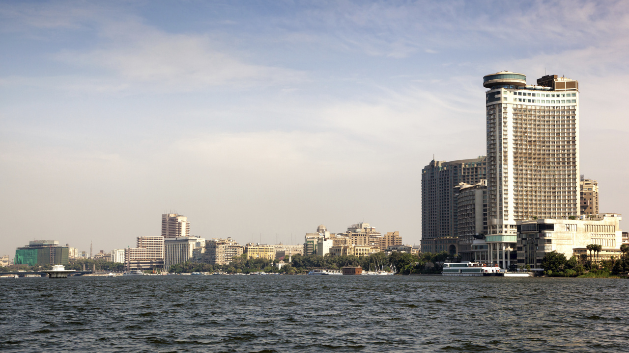 City Skyline Across Body of Water During Daytime. Wallpaper in 1280x720 Resolution