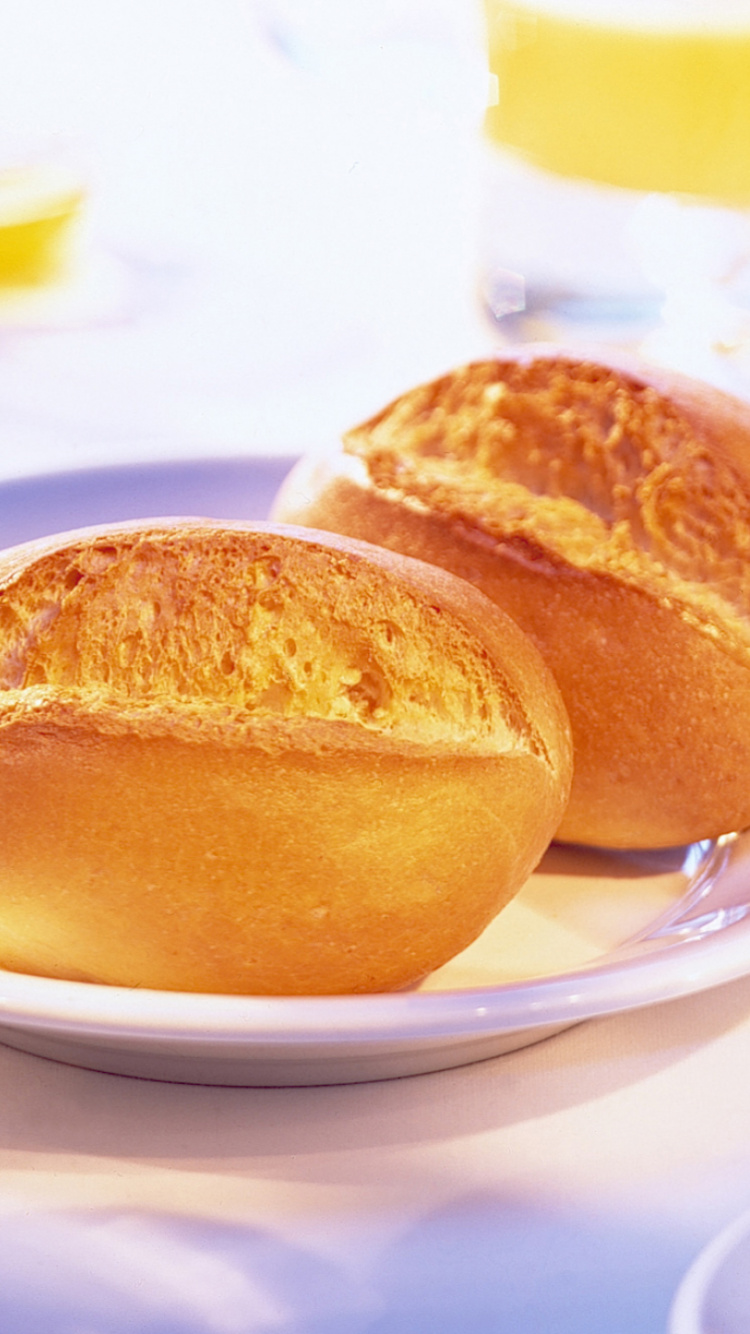 Bread on White Ceramic Plate Beside Clear Drinking Glass. Wallpaper in 750x1334 Resolution