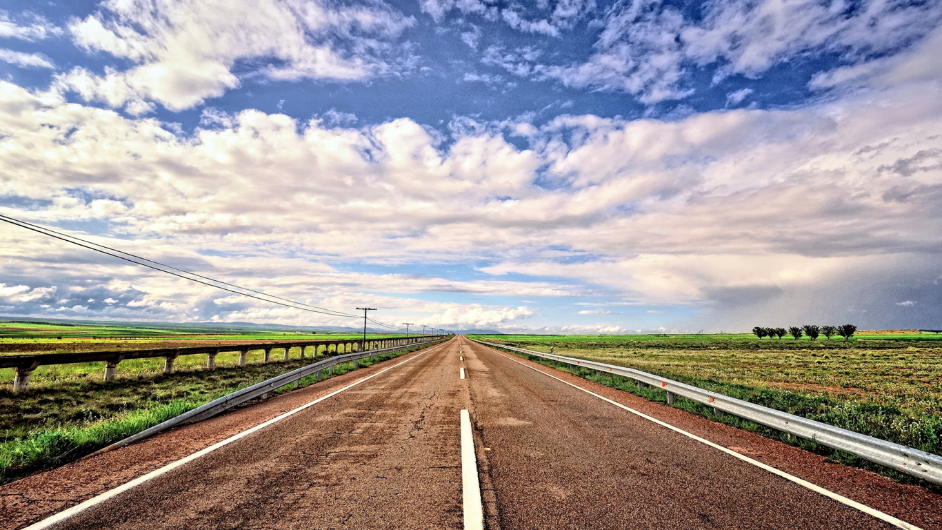 Gray Concrete Road Under Blue Sky and White Clouds During Daytime. Wallpaper in 1366x768 Resolution