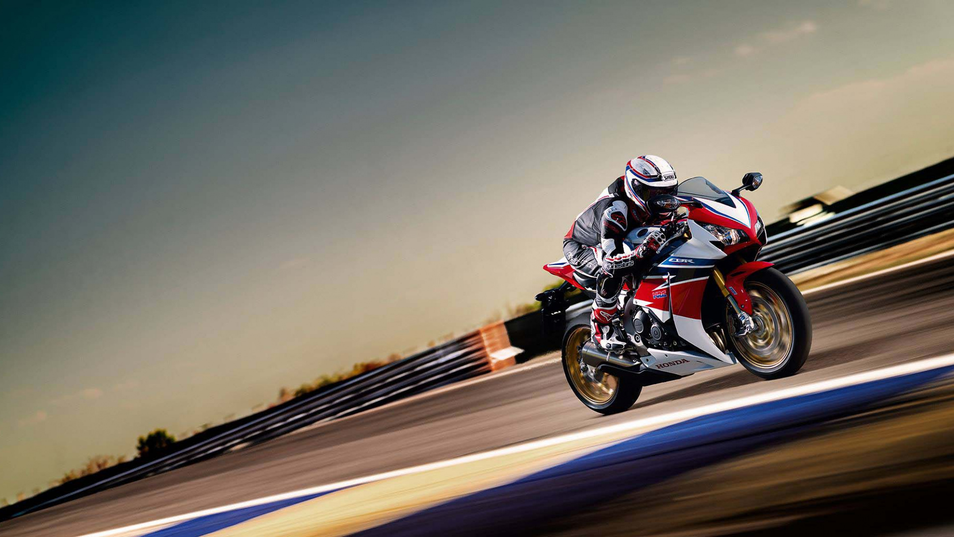 Man in Black and White Motorcycle Suit Riding on Motorcycle. Wallpaper in 1920x1080 Resolution