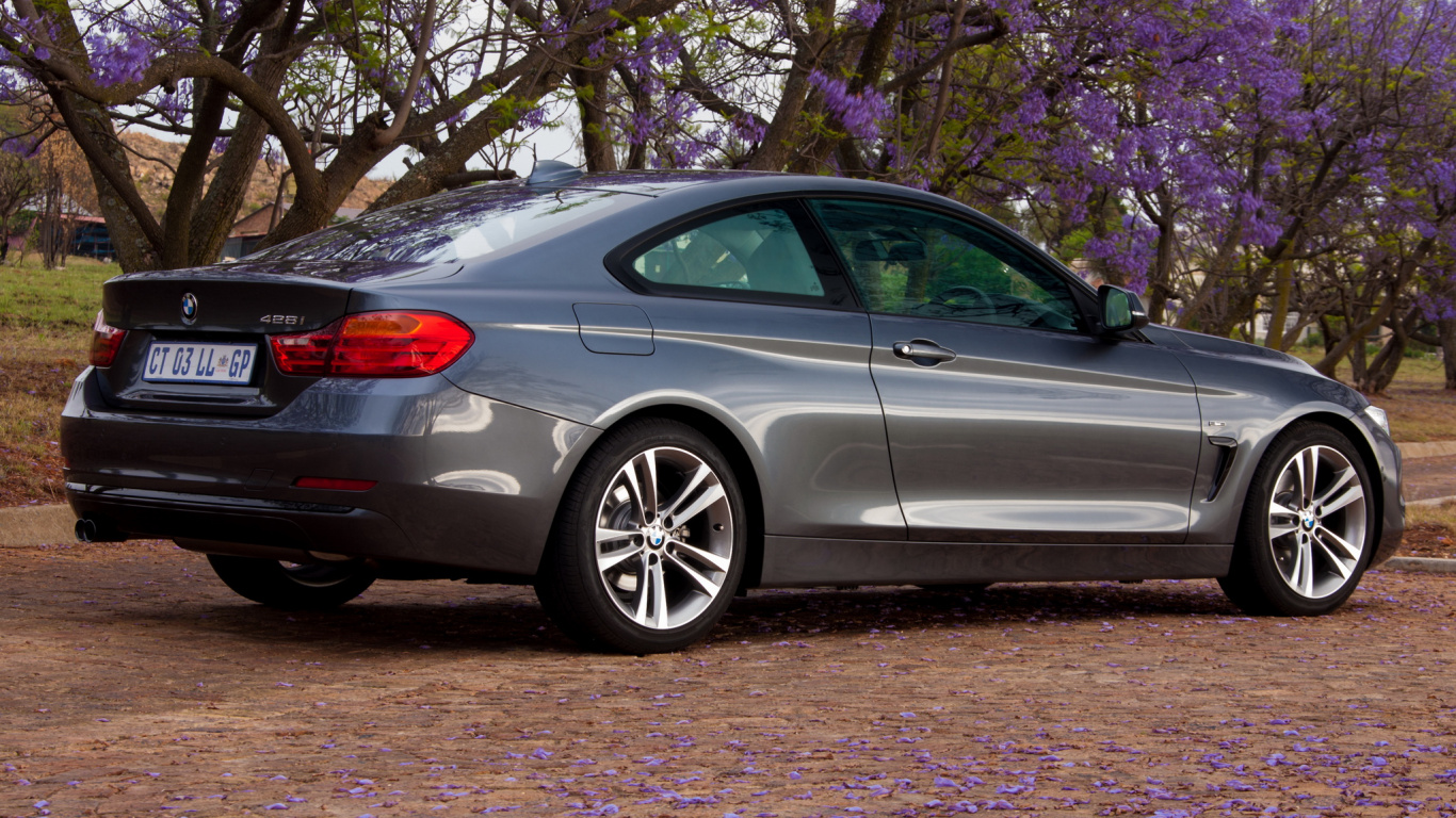 Silver Sedan Parked Beside Purple Leaf Tree During Daytime. Wallpaper in 1366x768 Resolution