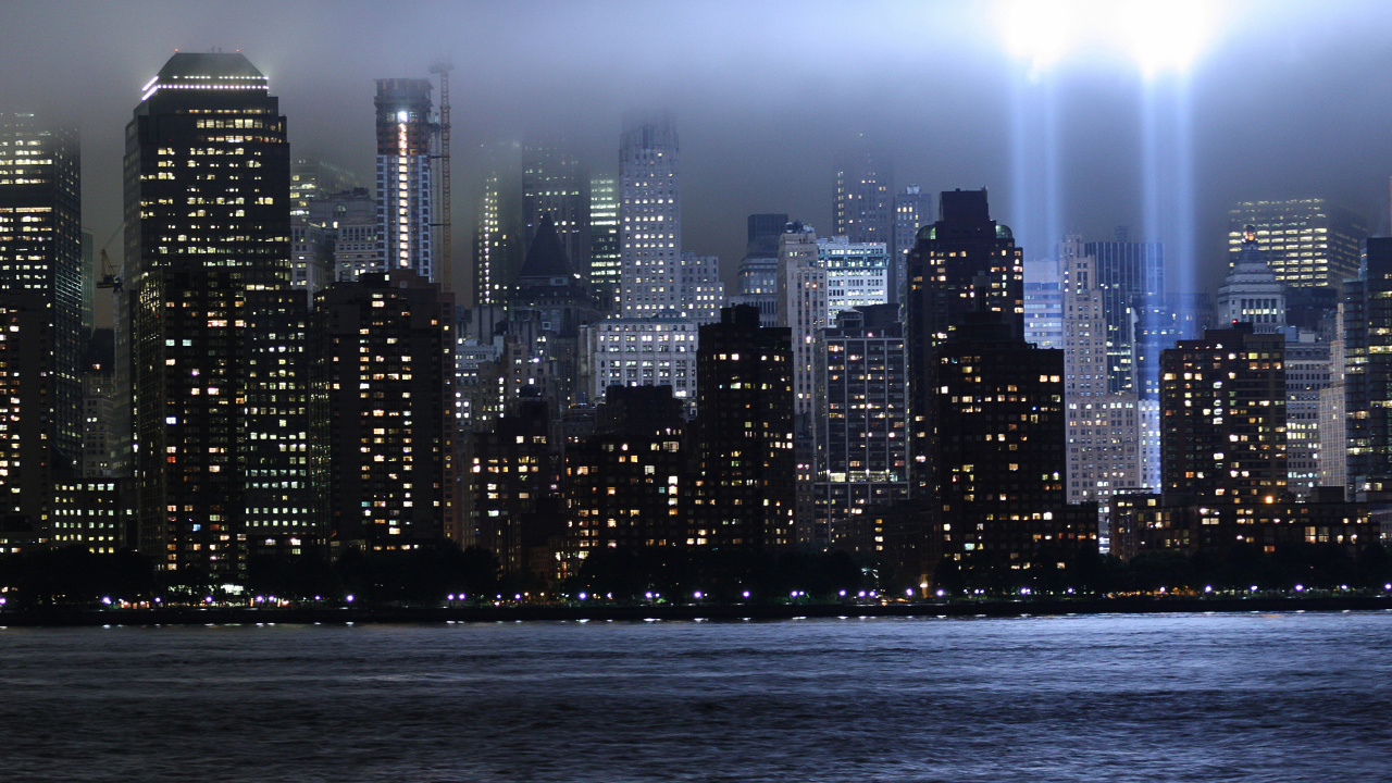 City Skyline Across Body of Water During Night Time. Wallpaper in 1280x720 Resolution