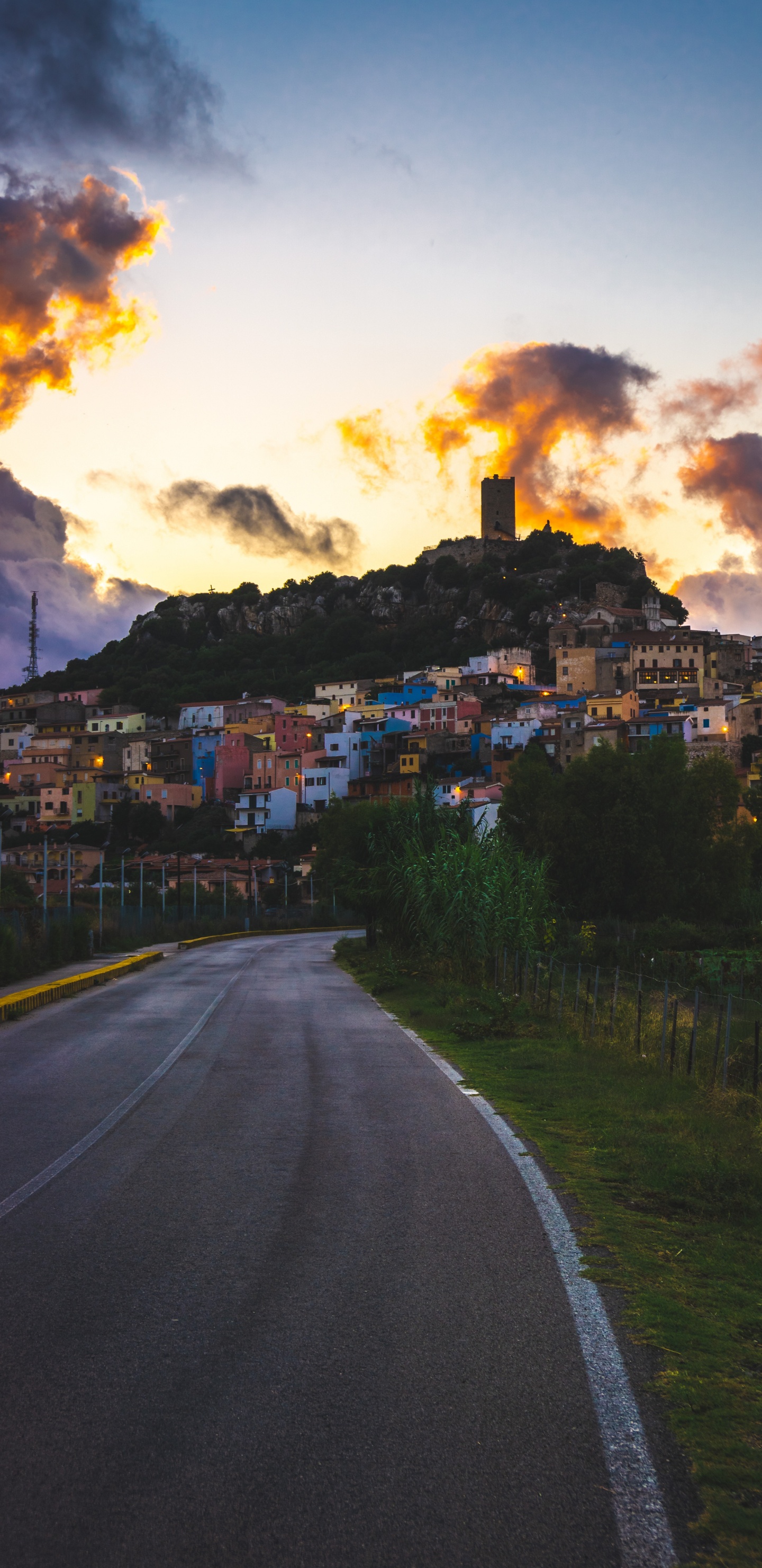 Gray Concrete Road Near Houses Under White Clouds. Wallpaper in 1440x2960 Resolution