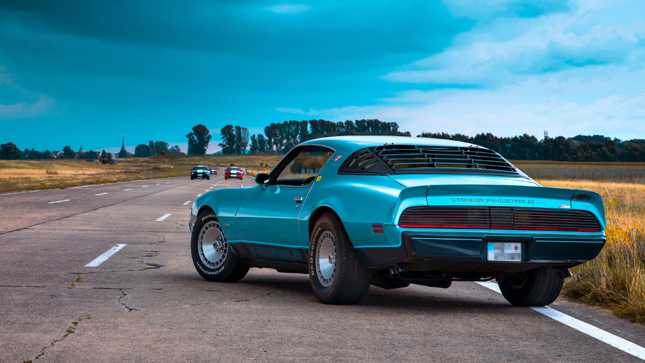 Teal Car on Gray Asphalt Road During Daytime. Wallpaper in 1280x720 Resolution