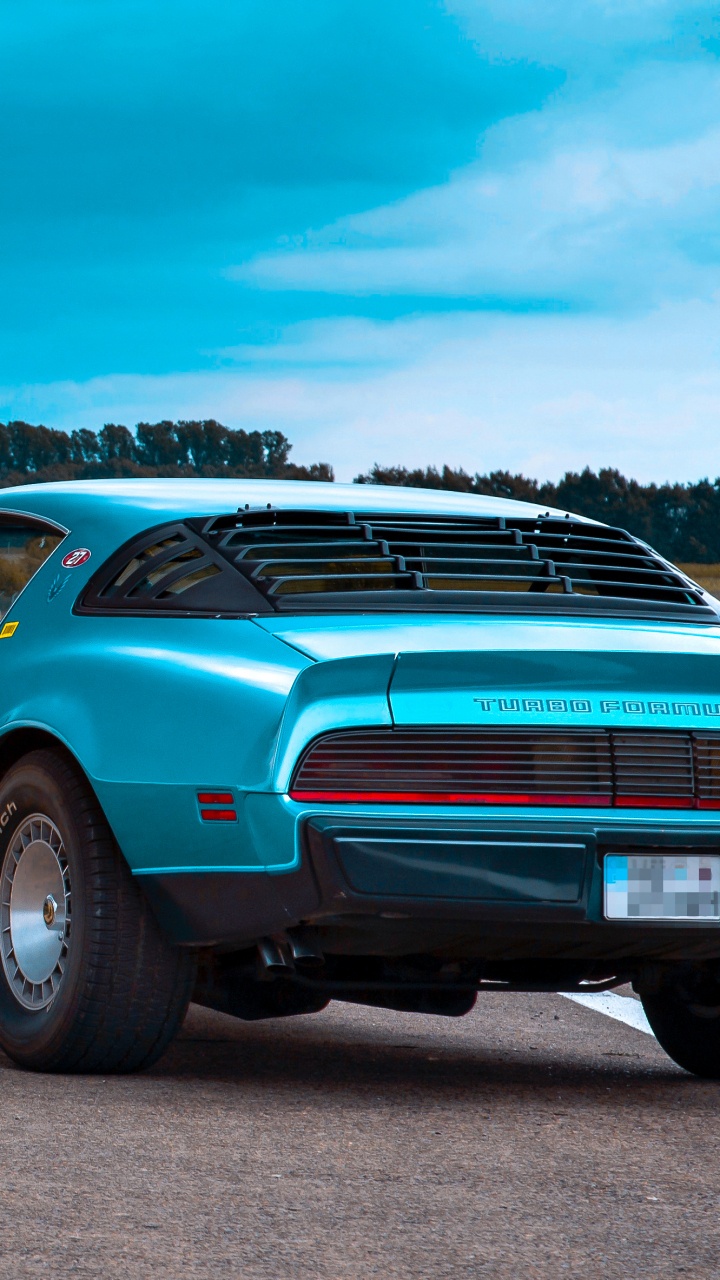 Teal Car on Gray Asphalt Road During Daytime. Wallpaper in 720x1280 Resolution