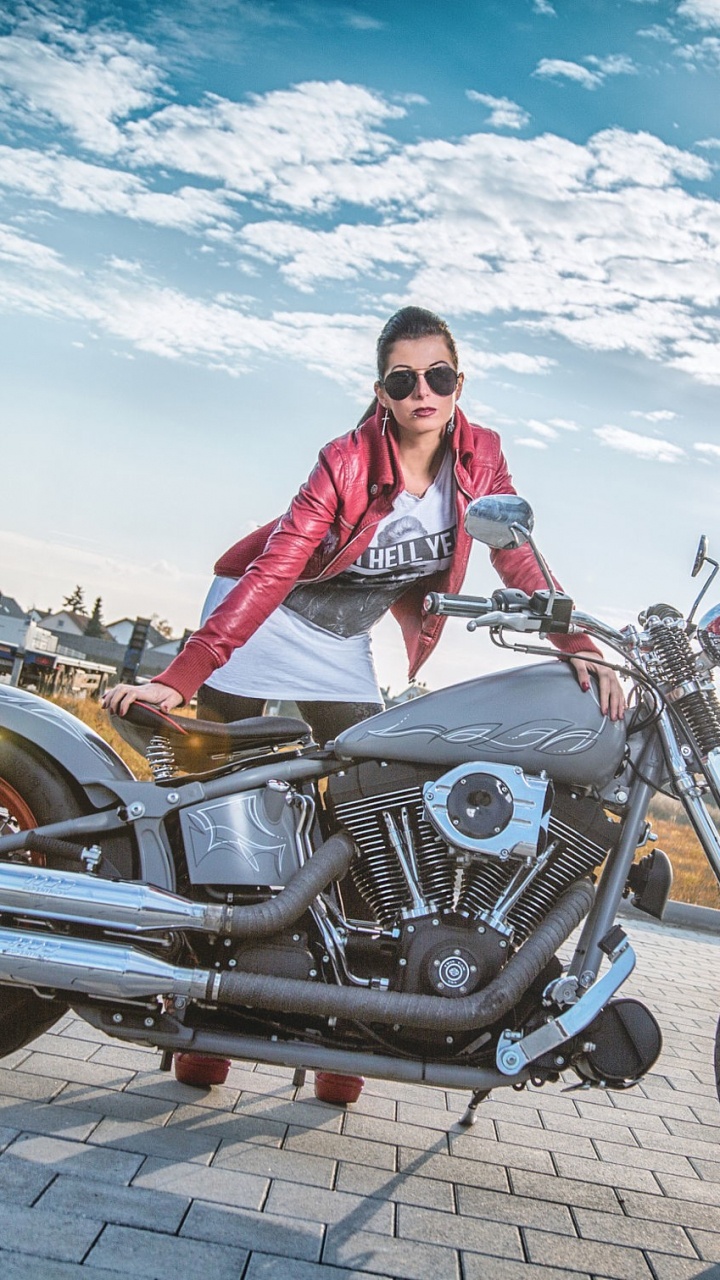 Woman in Pink Jacket Riding on Black Cruiser Motorcycle. Wallpaper in 720x1280 Resolution