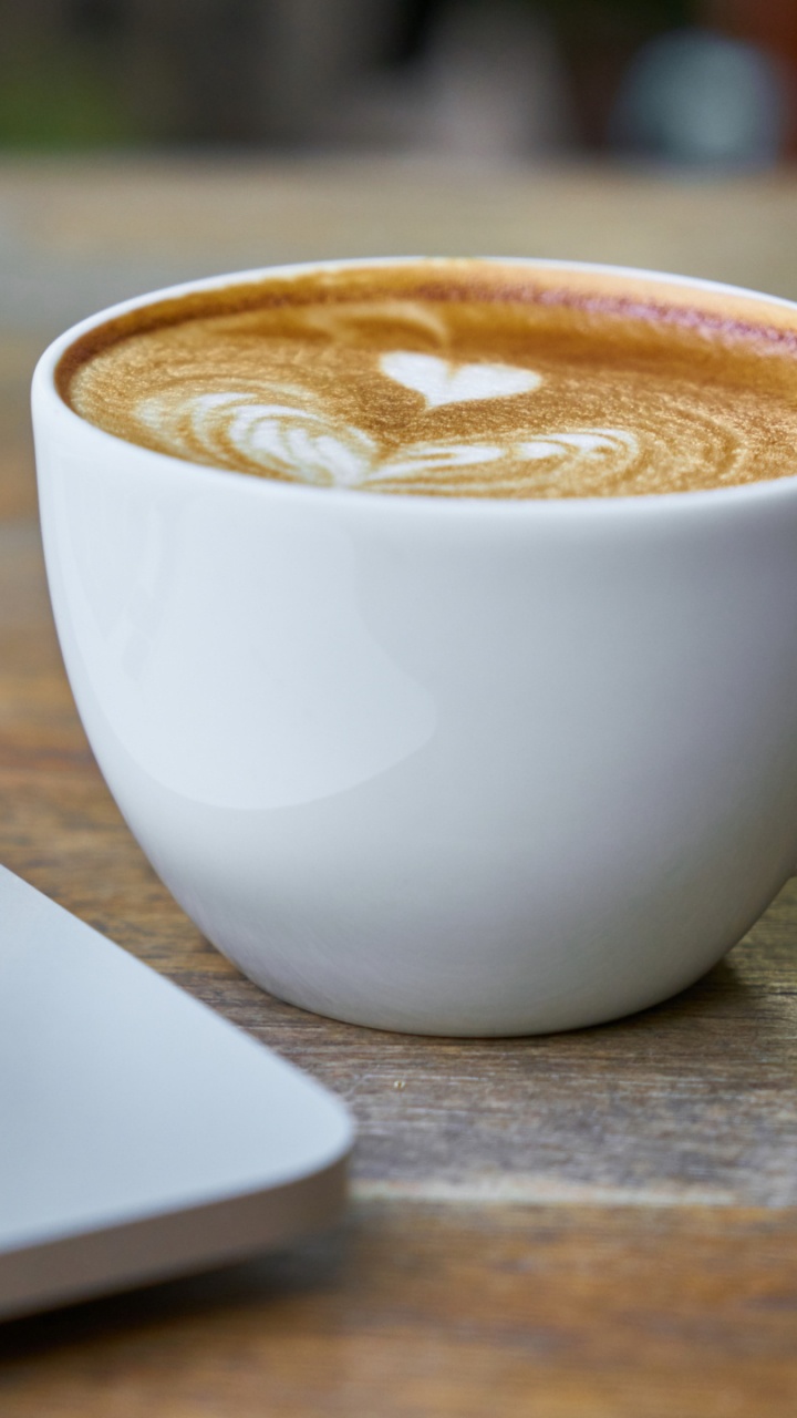 White Ceramic Cup With Brown Liquid Inside. Wallpaper in 720x1280 Resolution