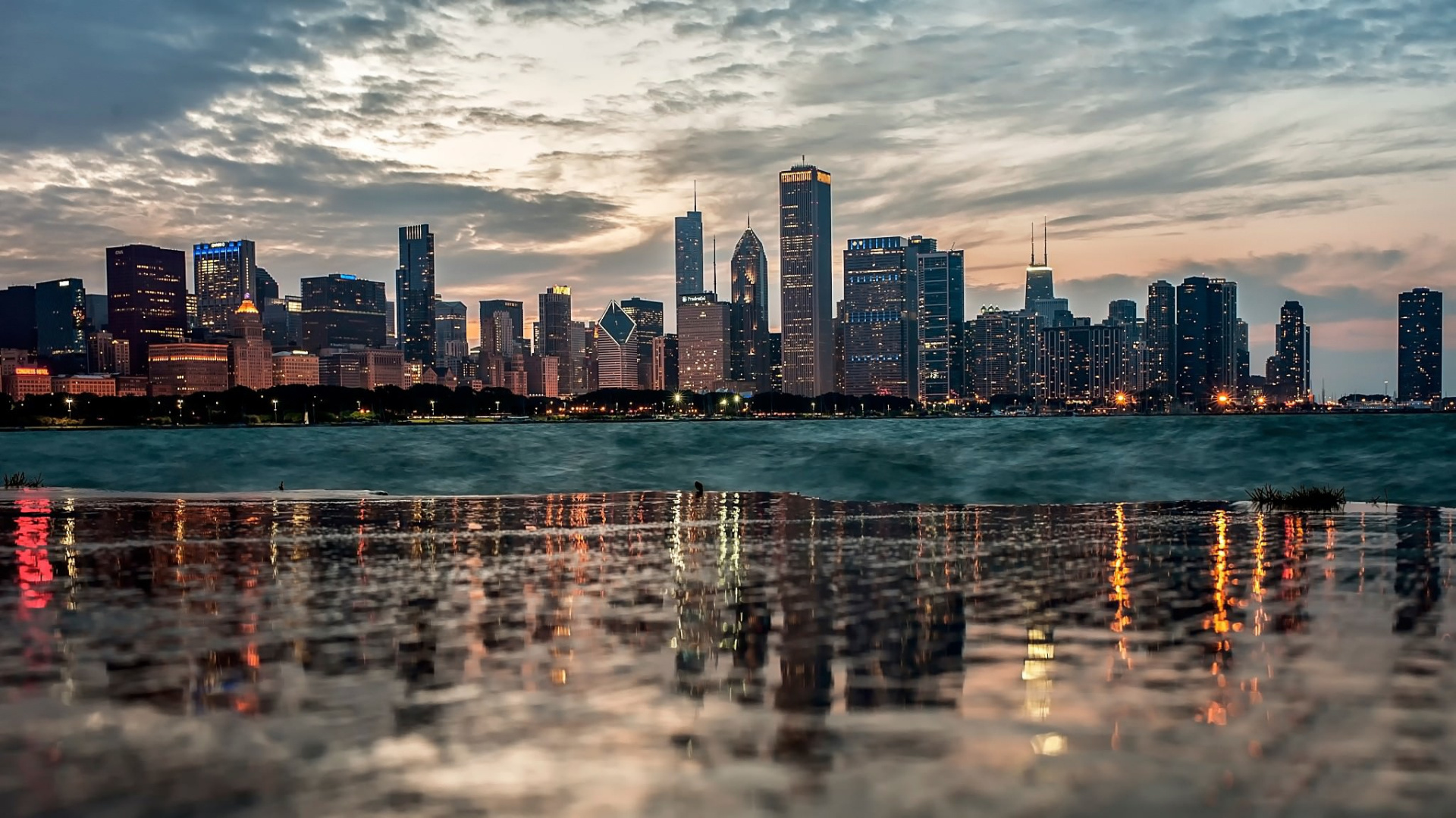 City Skyline Across Body of Water During Daytime. Wallpaper in 1920x1080 Resolution