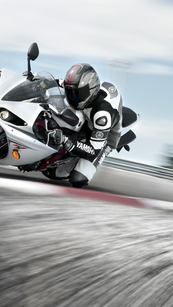 Man Riding on Sports Bike. Wallpaper in 720x1280 Resolution