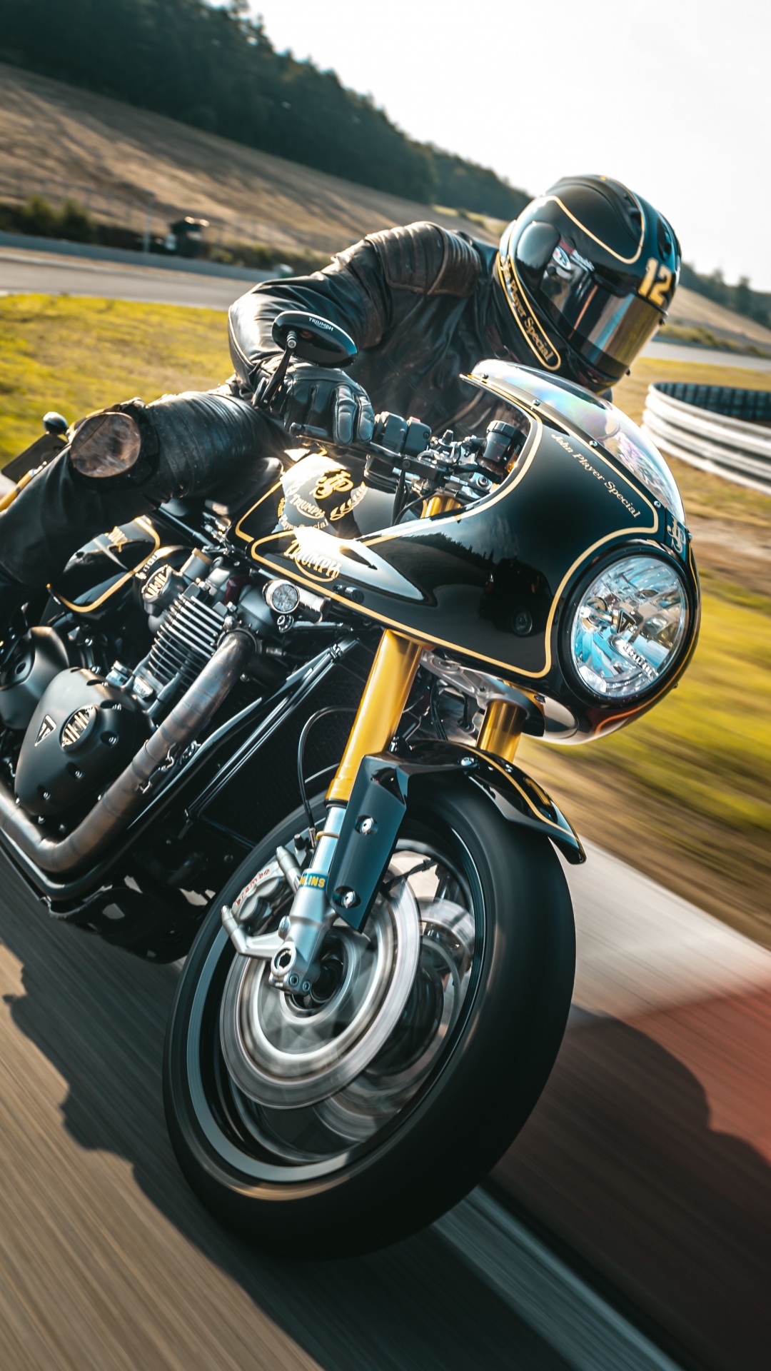 Man in Black and White Motorcycle Helmet Riding on Black Sports Bike on Brown Field During. Wallpaper in 1080x1920 Resolution