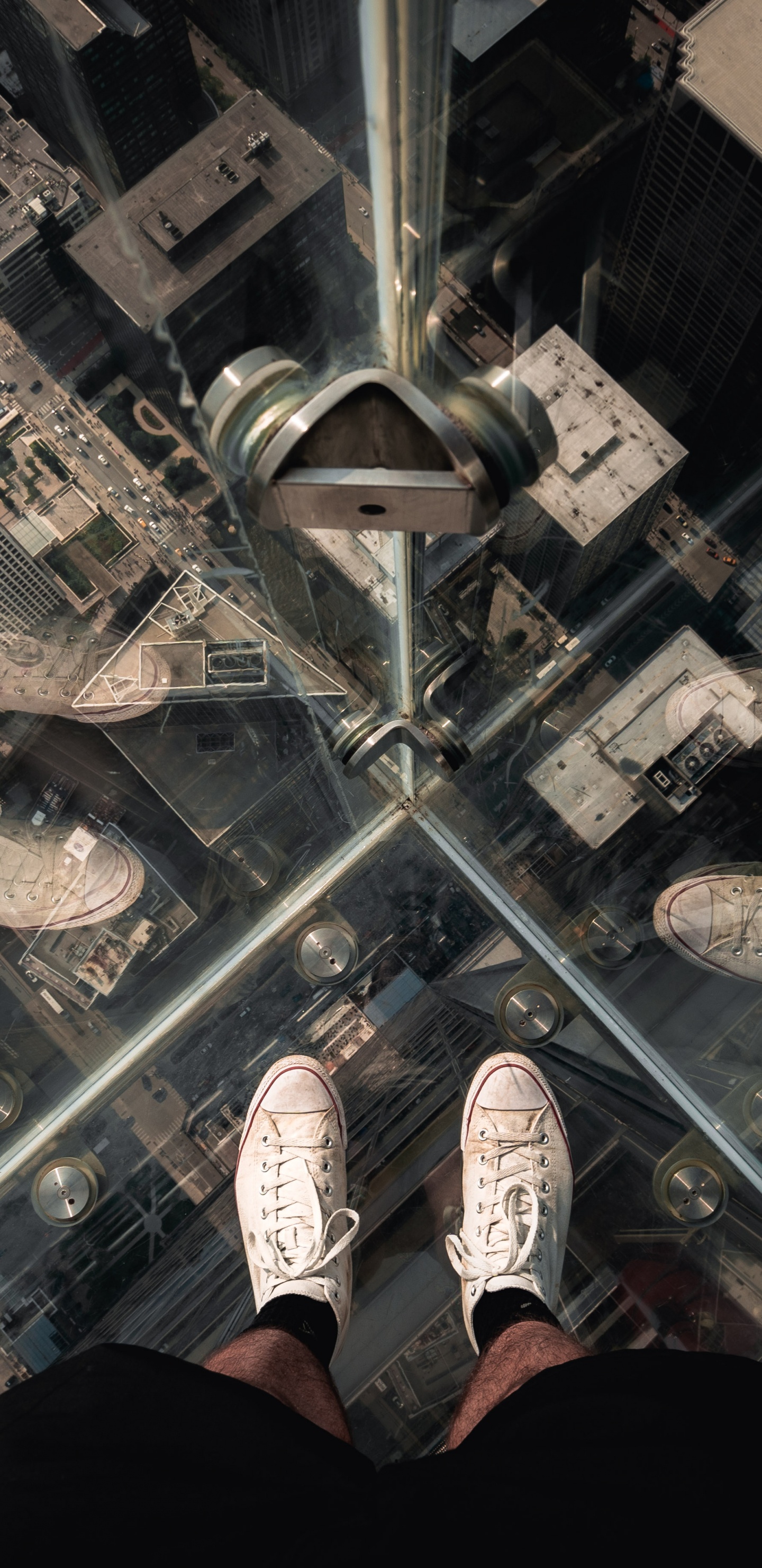 Person in Black Pants and White Sneakers Standing on Glass Top Table. Wallpaper in 1440x2960 Resolution