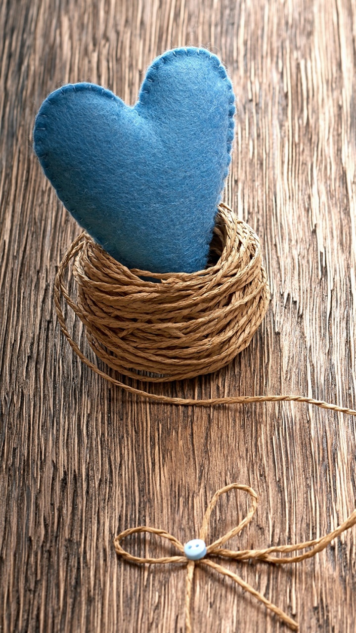 Person in Blue Socks Standing on Brown Wooden Floor. Wallpaper in 720x1280 Resolution